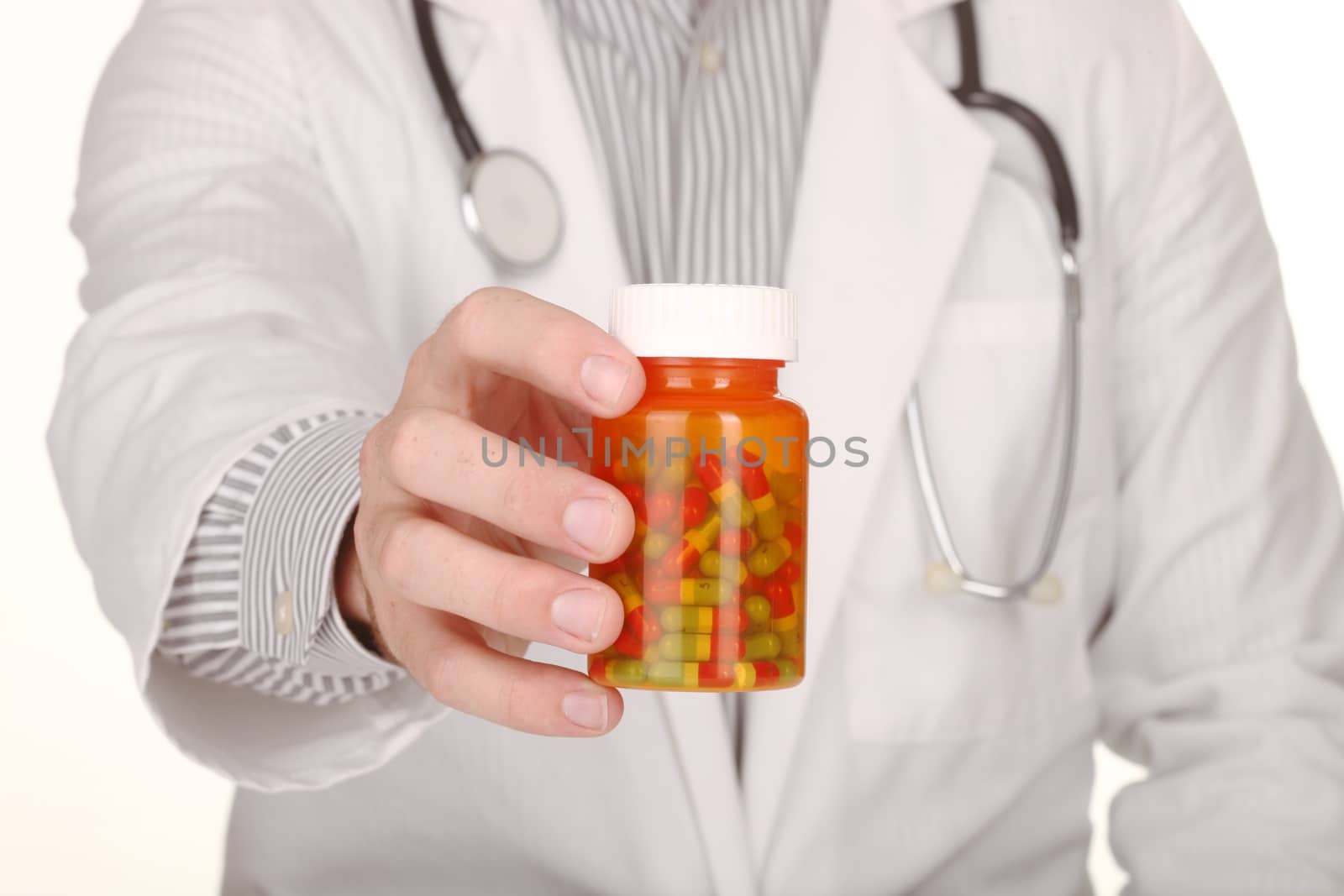 Doctor With Medication in Prescription Bottles by tobkatrina