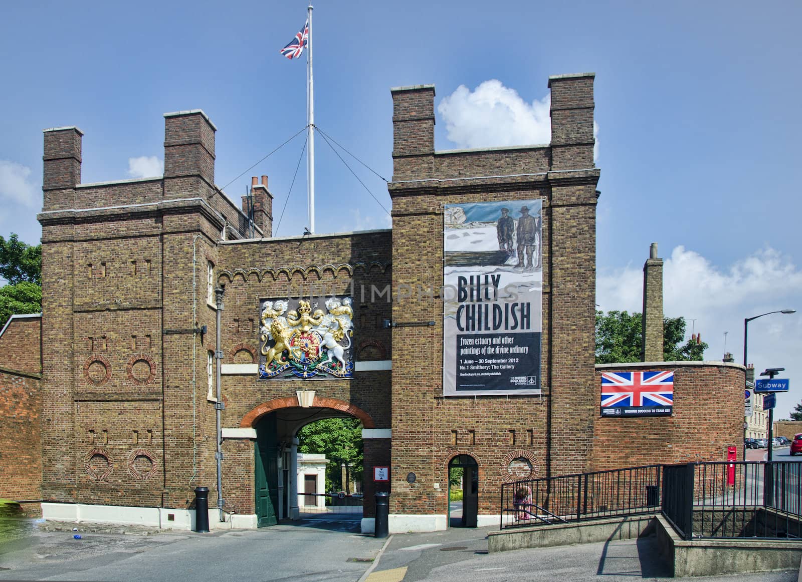 The main gate into Chatham dockyard with flag flying and crest above gate