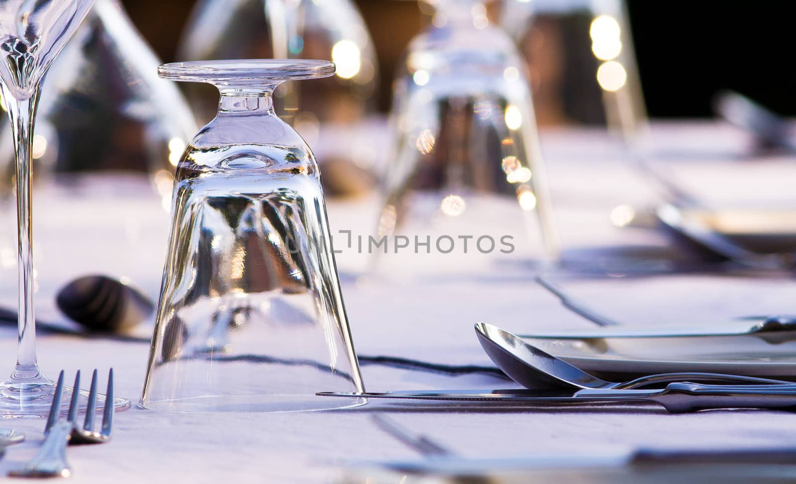 Beautifull restaurant setting of glasses and cutlery on a table