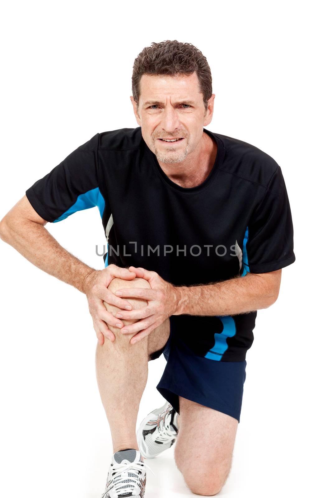 adult attractive man in sportswear knee pain injury ache isolated on white