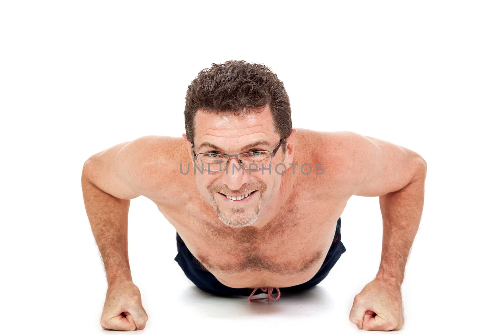 adult smiling man doing workout pushups fitness isolated on white