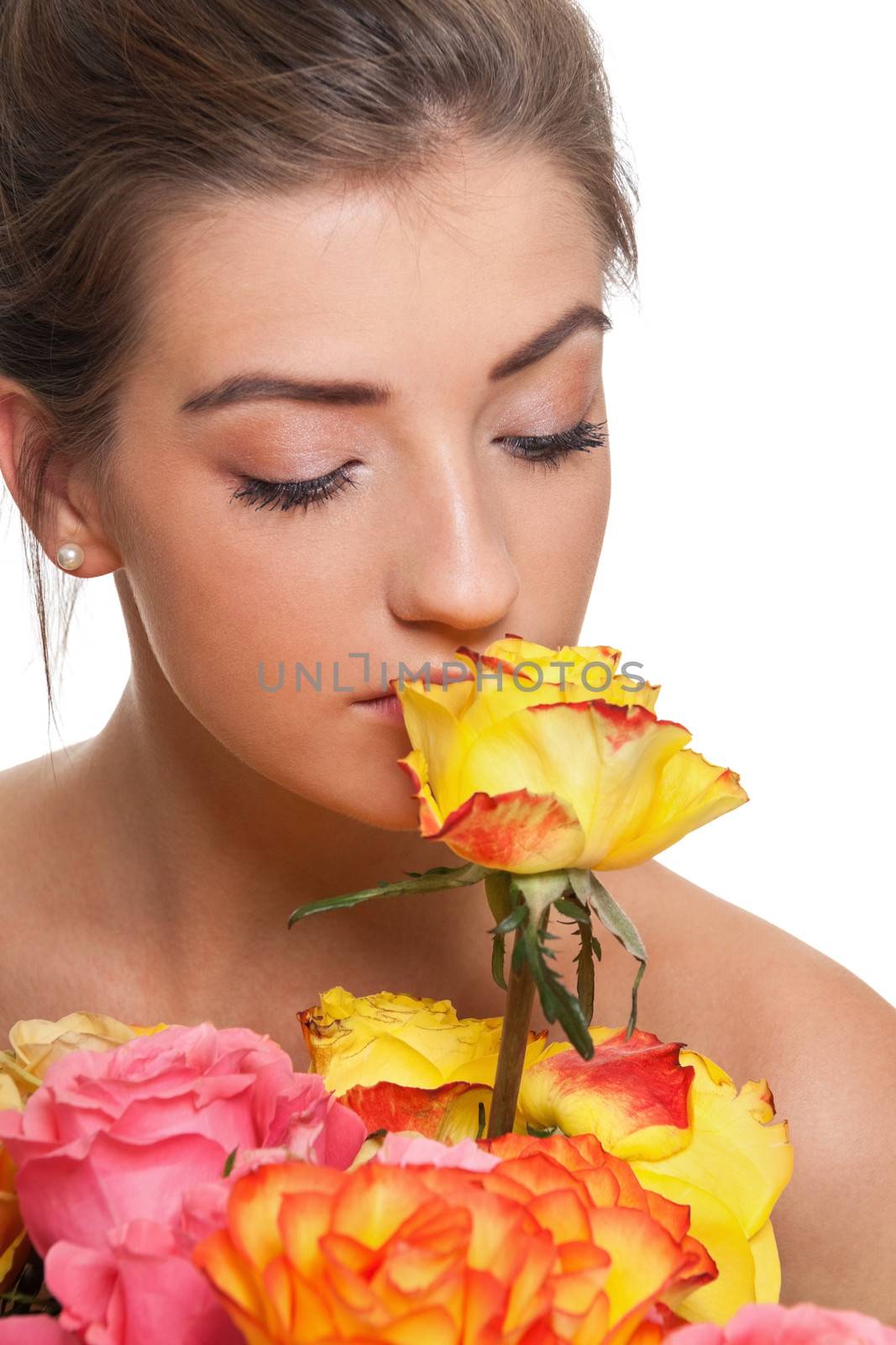 attractive young smiling woman with flowers roses isolated on white