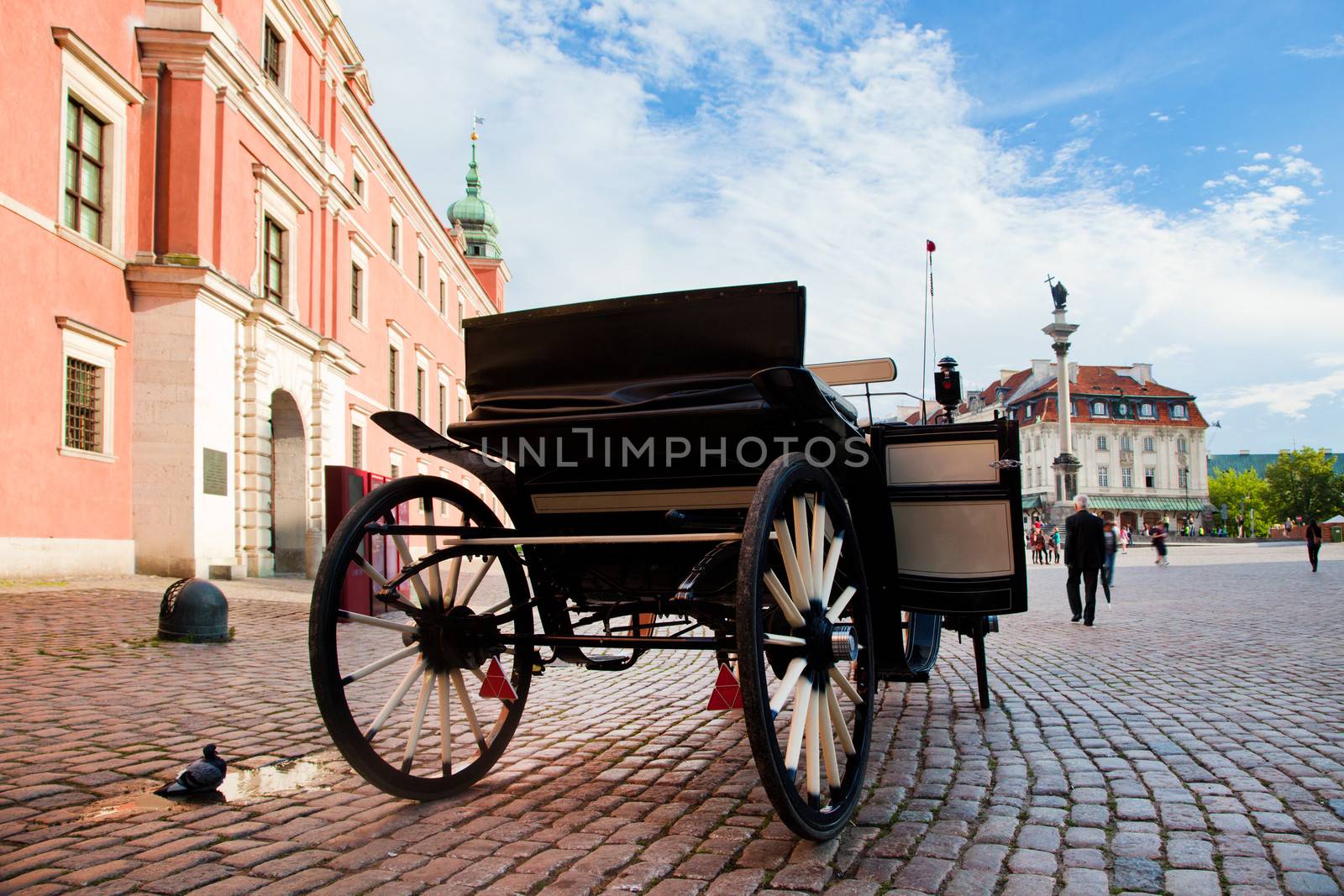 Krakowskie Przedmiescie, the old town of Warsaw, Poland. Horse hackney carriage on cobblestone