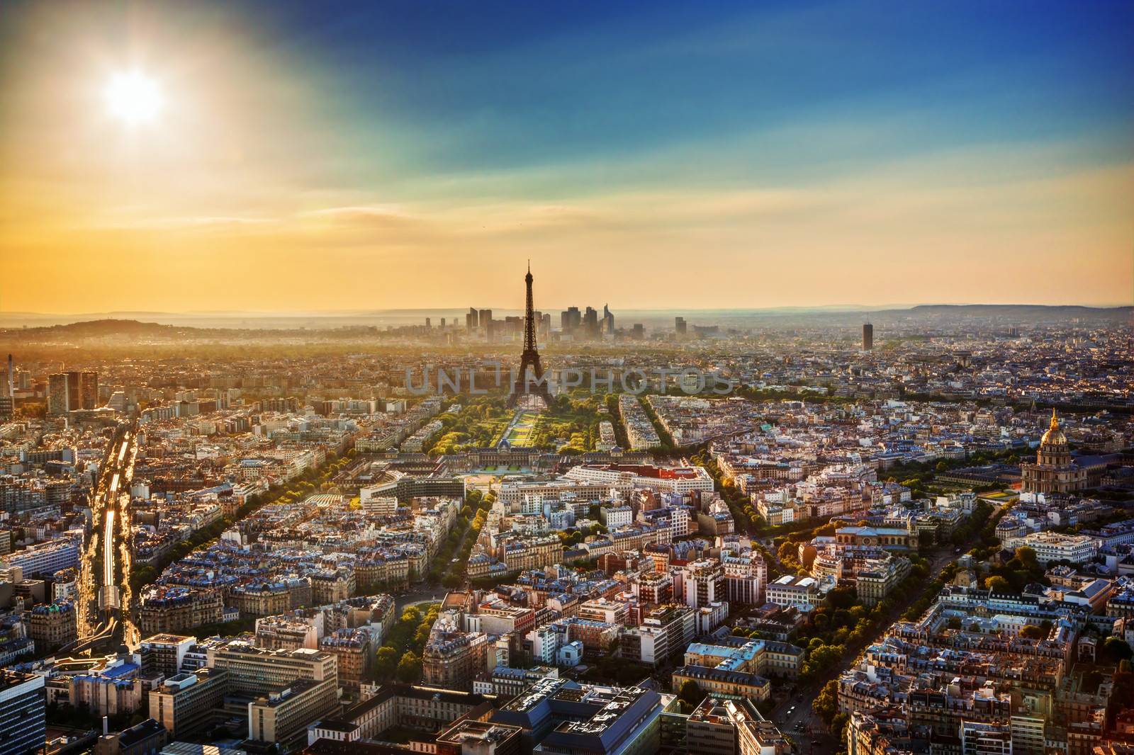 Paris, France at sunset. Aerial view on the Eiffel Tower, Arc de Triomphe, Les Invalides etc. 
