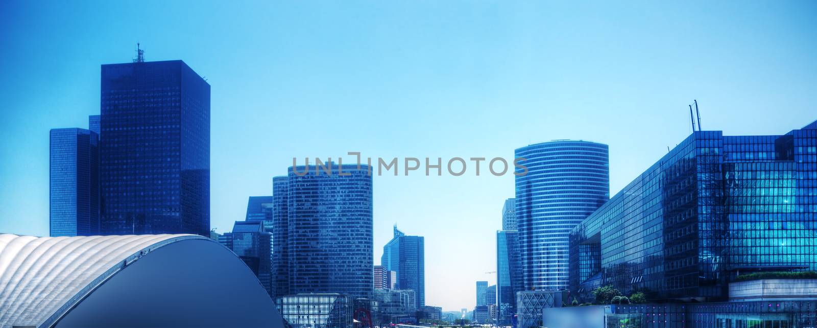 Business skyscrapers panorama in blue tint. Paris, France by photocreo