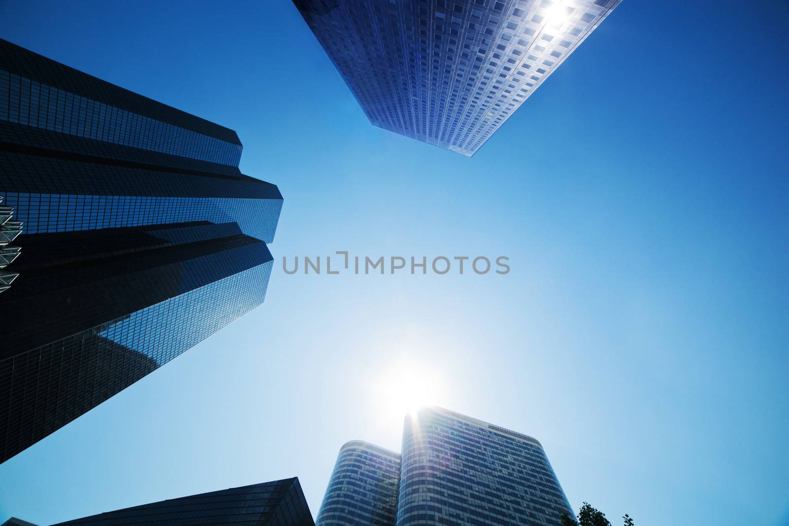 Business skyscrapers, sunny blue sky. La Defense financial district in Paris, France.
