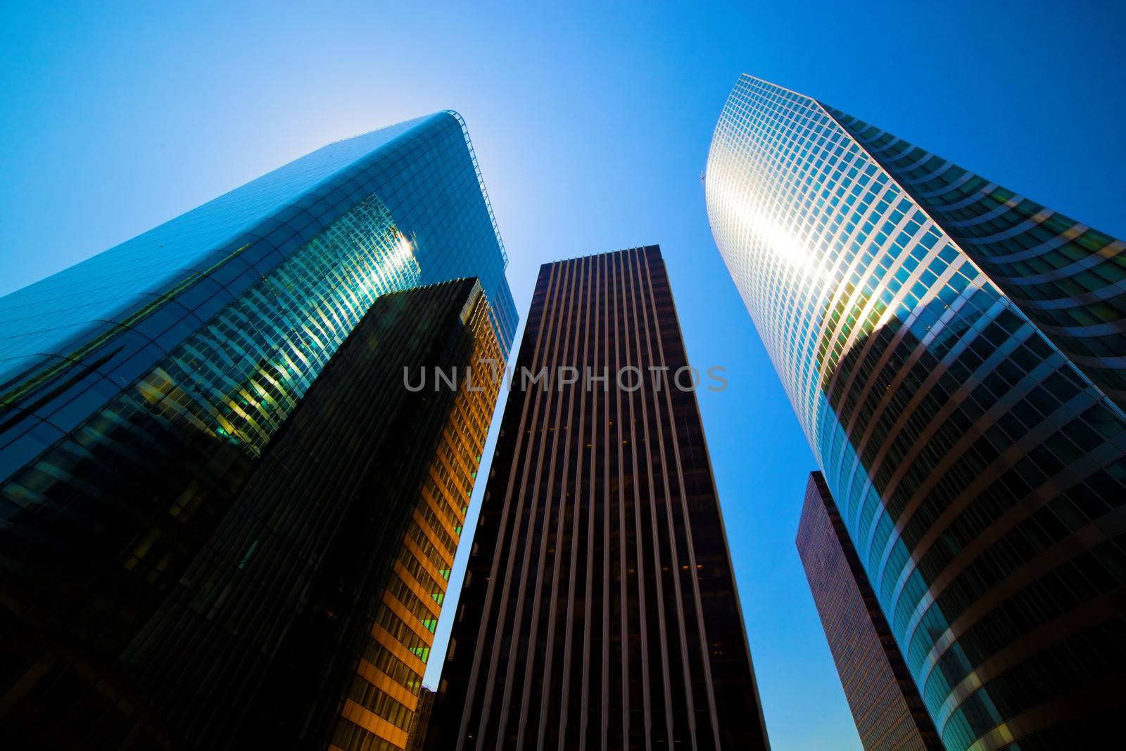 Business skyscrapers, sunny blue sky. La Defense financial district in Paris, France.