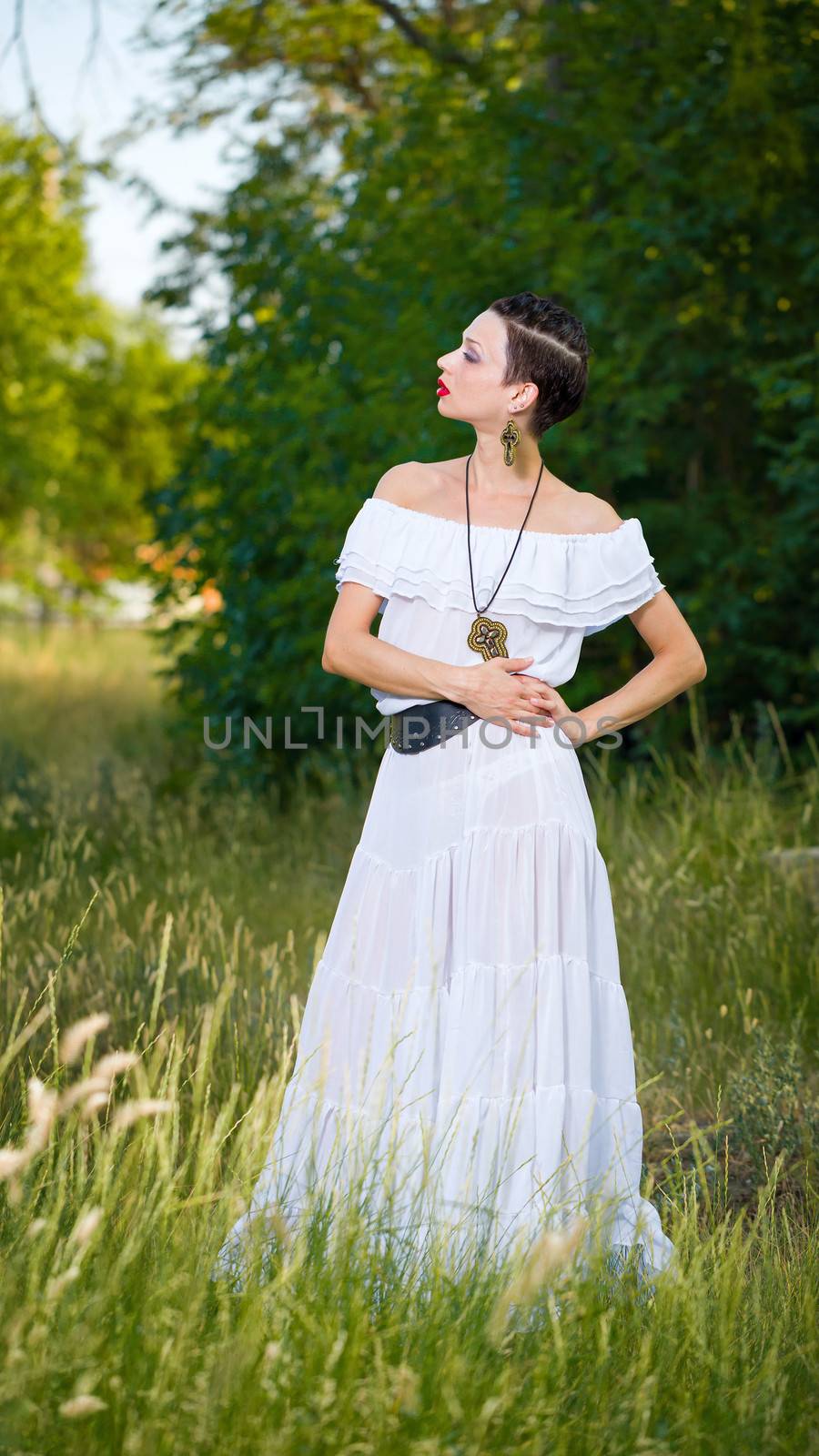 Girl in a White Dress on the Nature