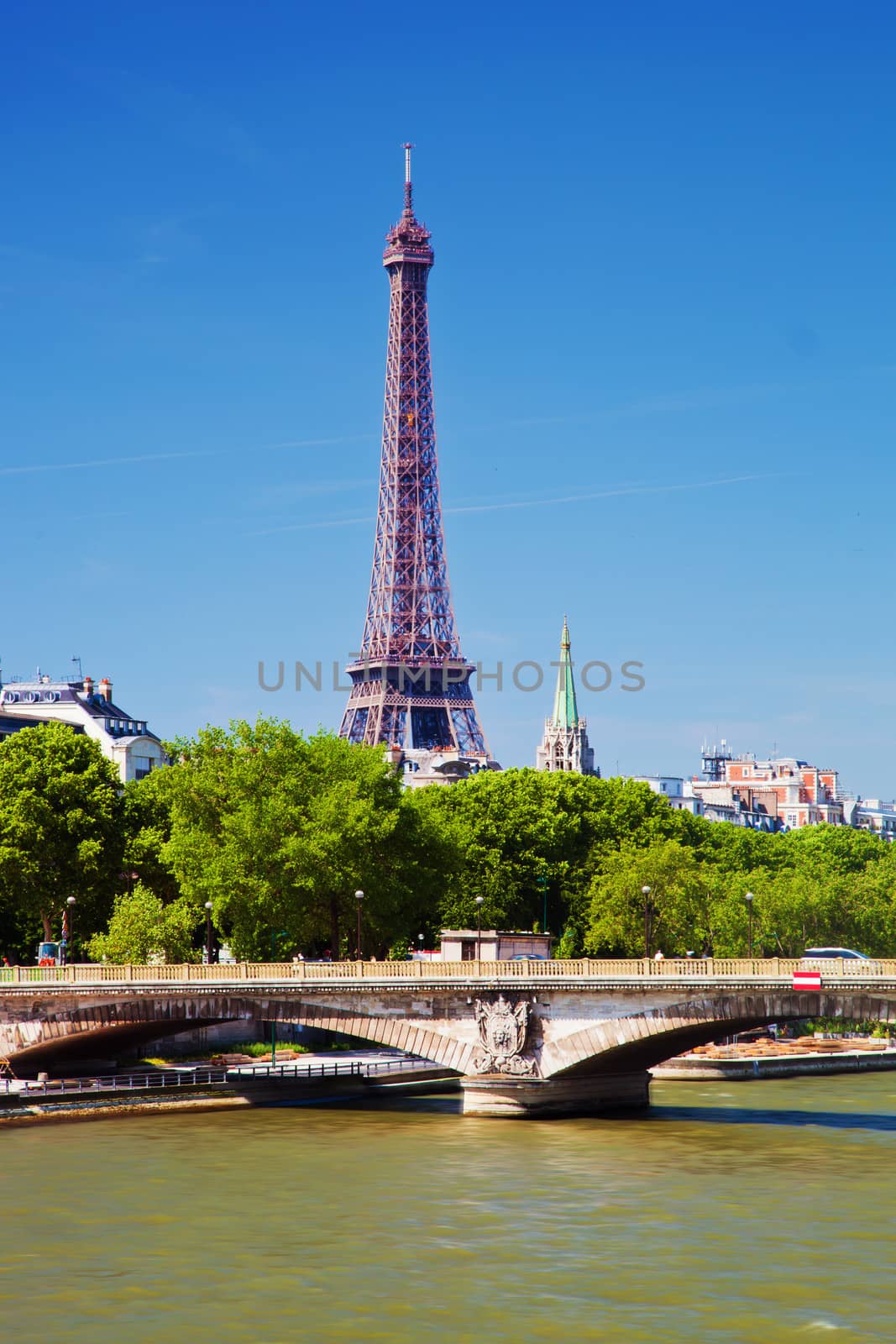 Eiffel Tower and bridge on Seine river in Paris, France. by photocreo