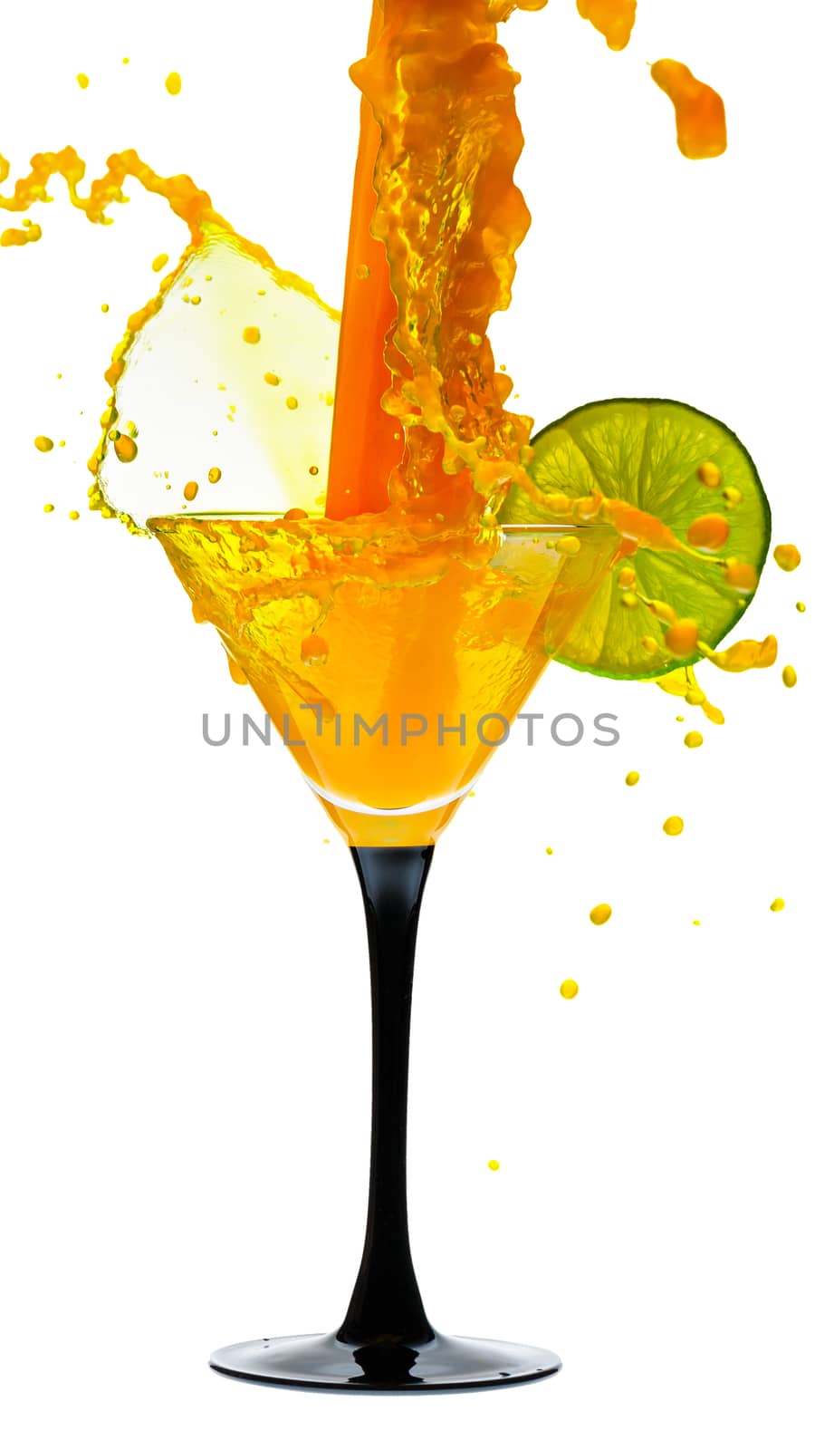 martini glass with lime and a splash of