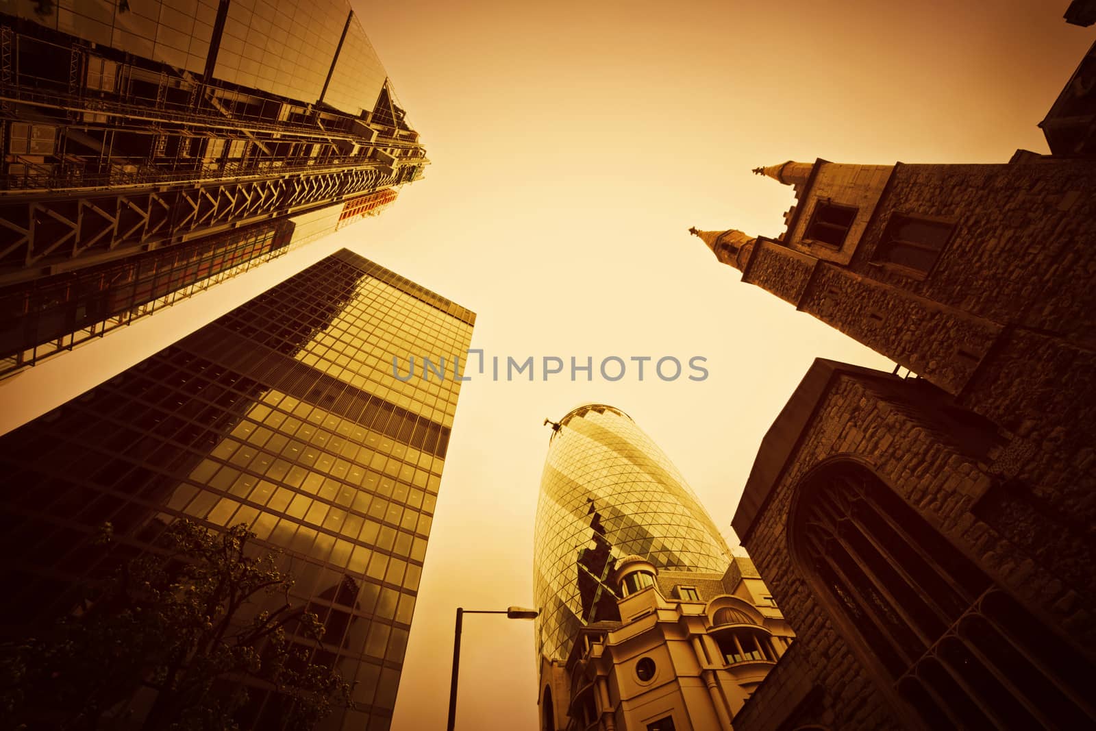 Business architecture, skyscrapers with a single old tower in London, the UK. Golden tint, conceptual