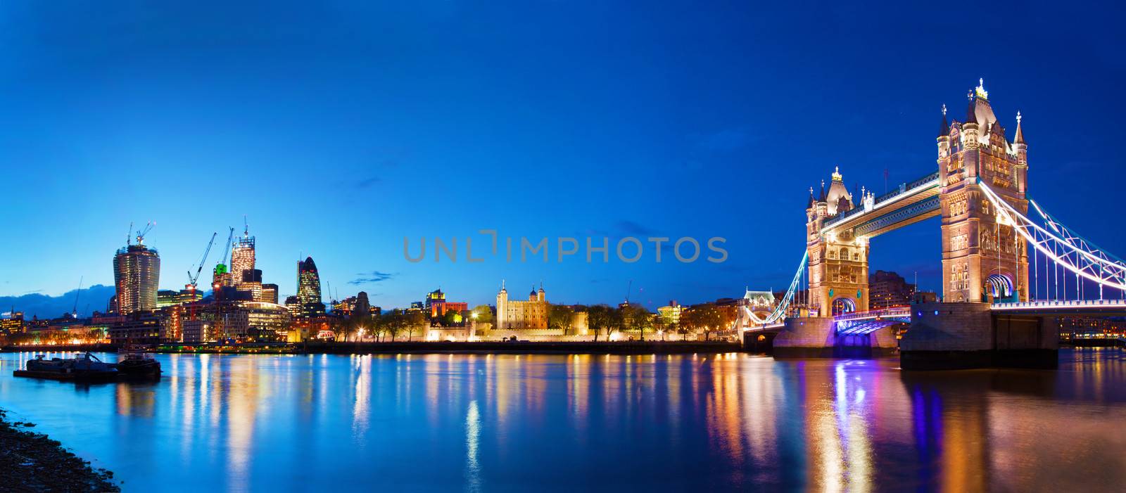 Tower Bridge in London, the UK at night by photocreo