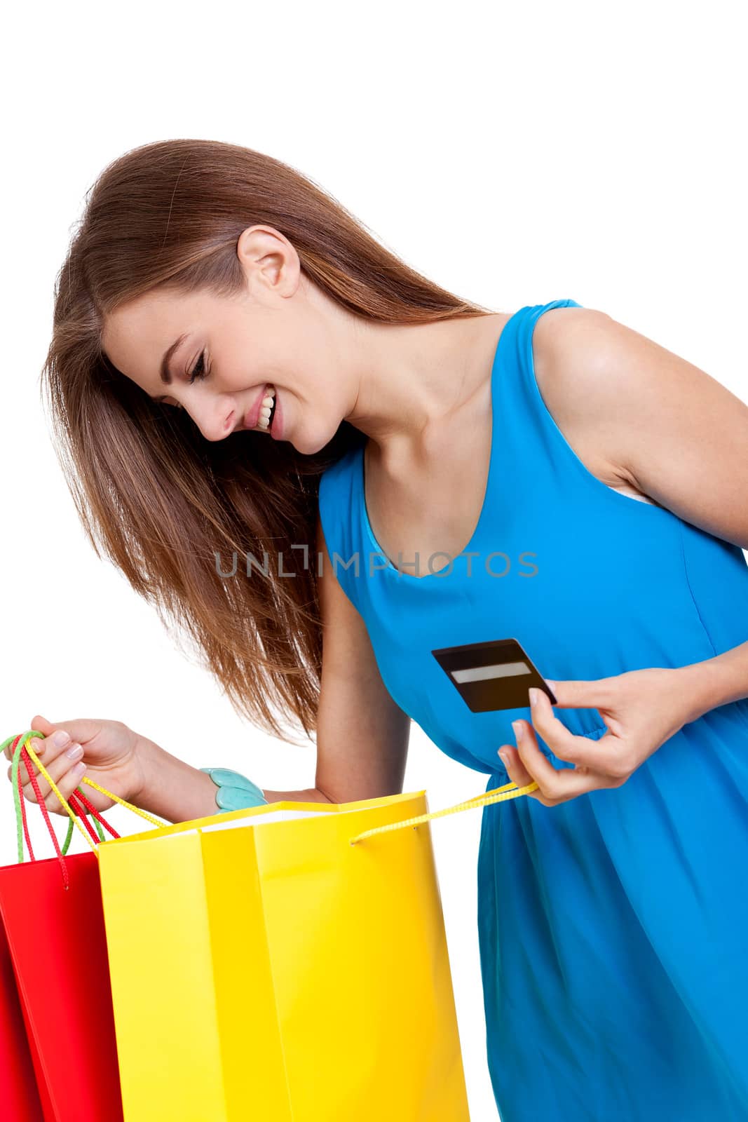 happy young woman with colorful shopping bags visa credit card isolated