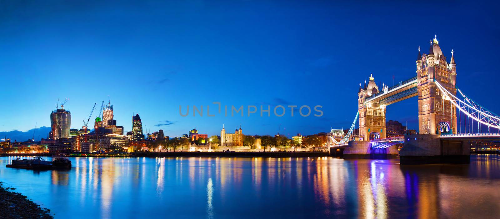 Tower Bridge in London, the UK at night by photocreo