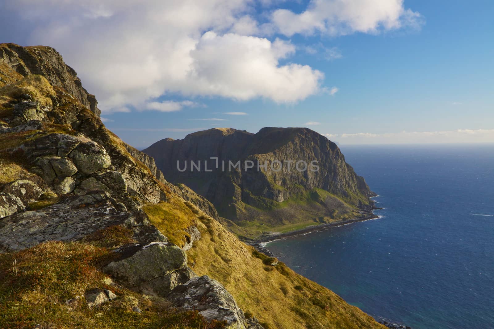 Scenic coastal cliffs on island of Vaeroy, Lofoten islands in Norway