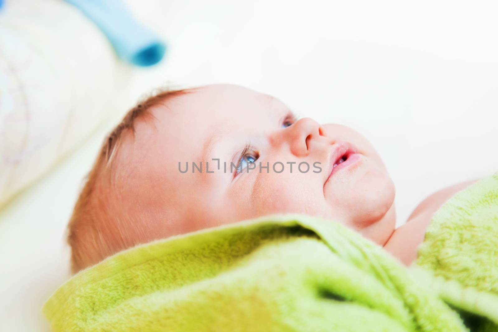 A baby waiting for changing his napkin by photocreo