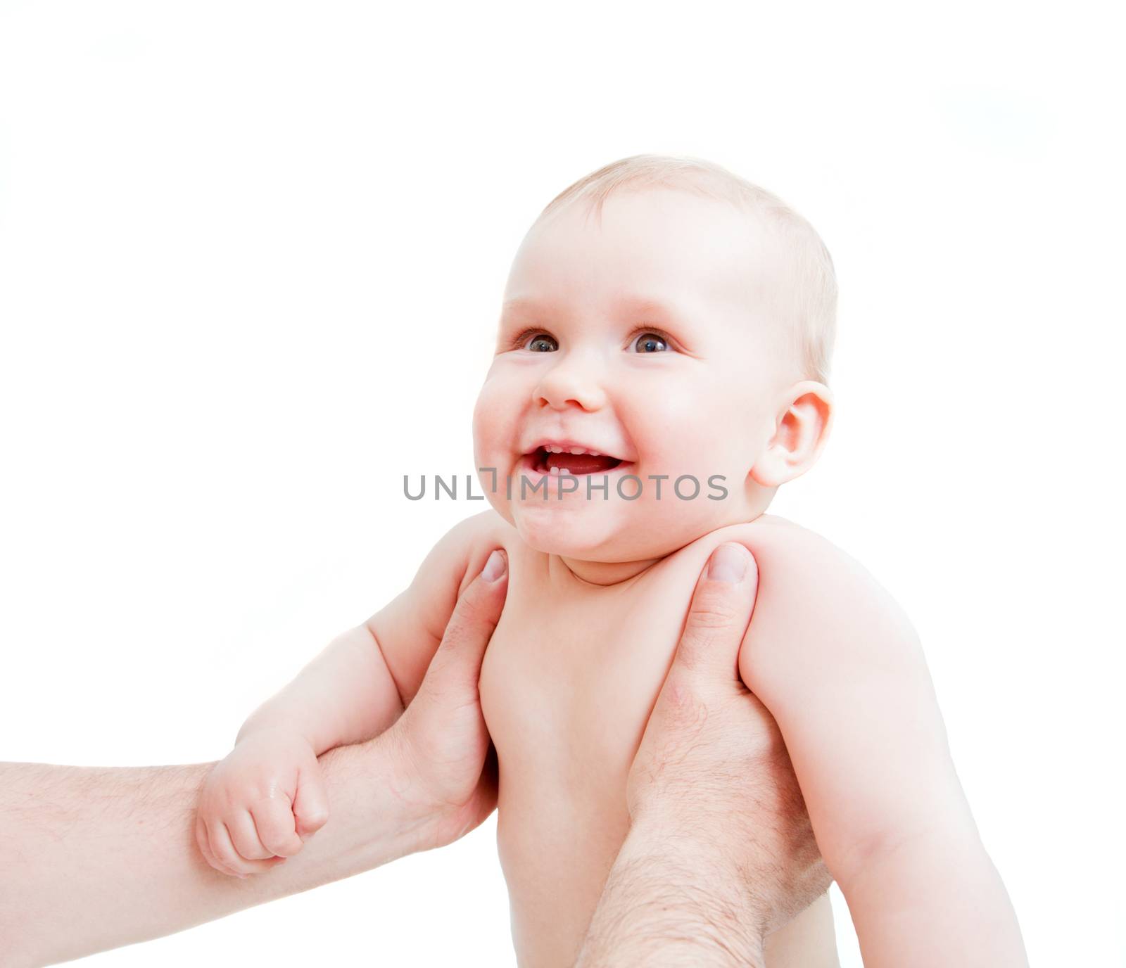 Cute happy baby laughing, held by his father by photocreo