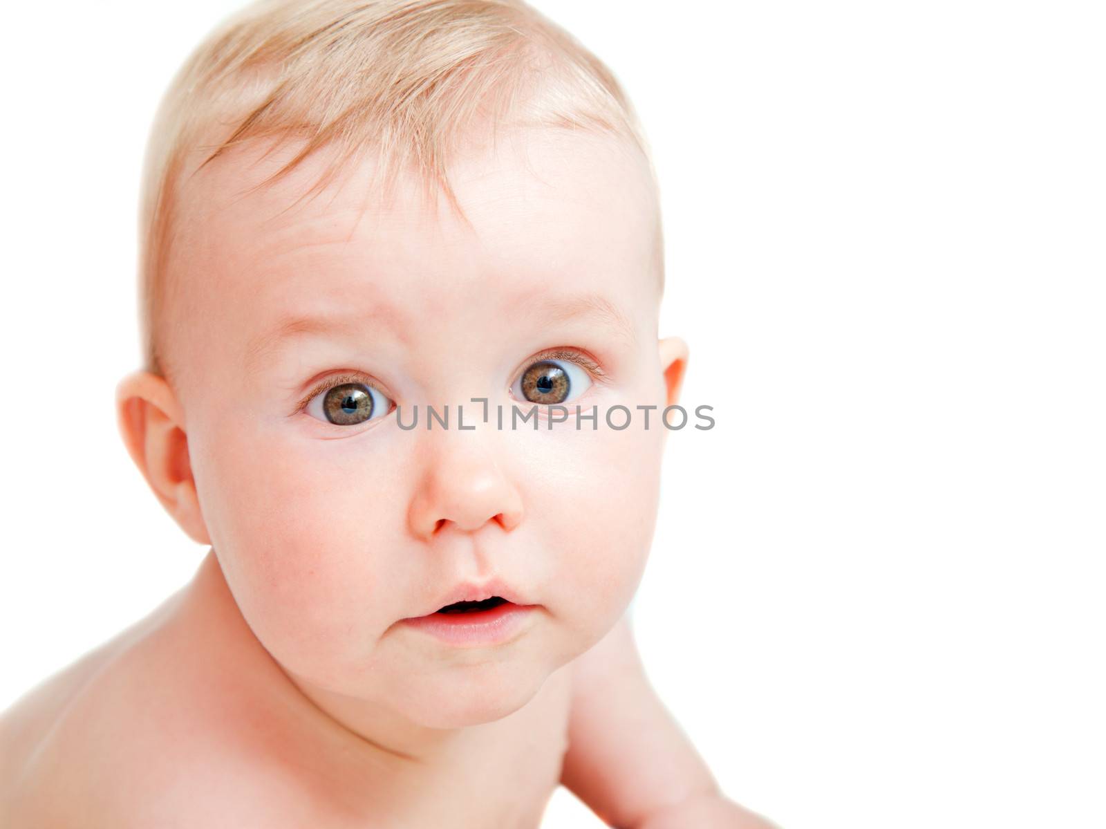 Cute baby with surprised face expression by photocreo