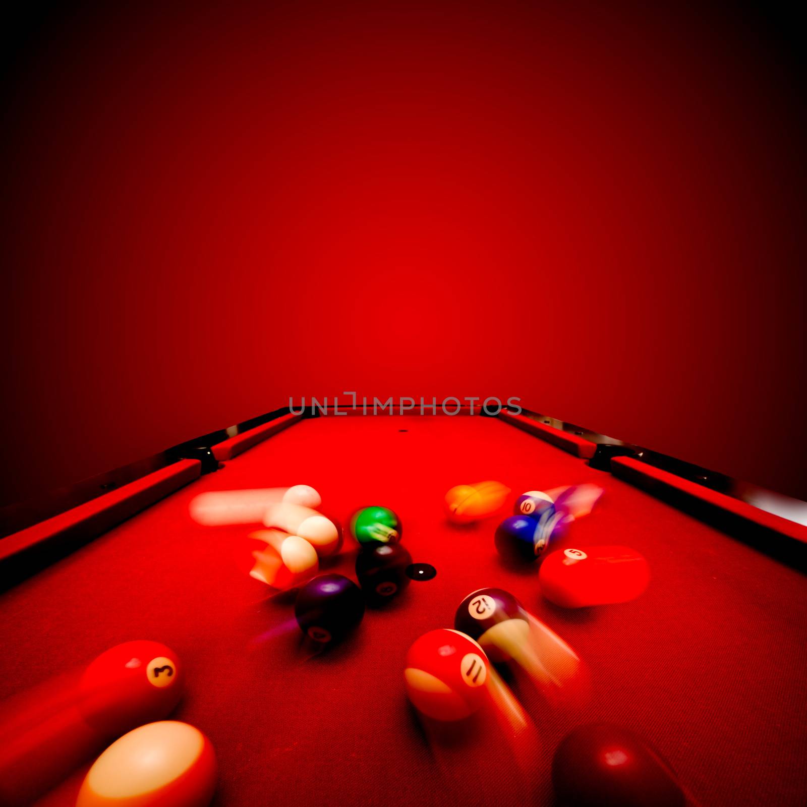 Billards pool game. Breaking the color ball from triangle. Red cloth table