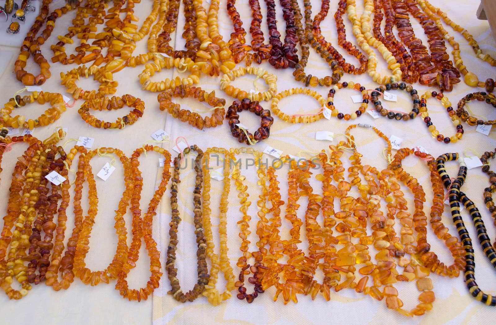 necklaces bracelet and other handmade jewelry. lithuanian national stone amber sold in city fair market.