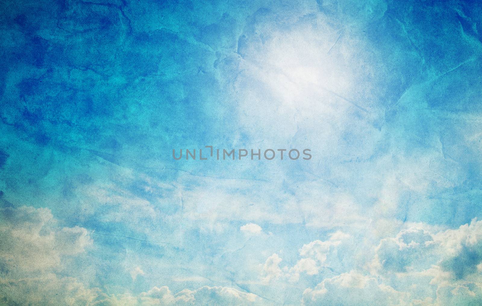 Vintage, retro image of sunny blue sky. Grunge canvas texture by photocreo