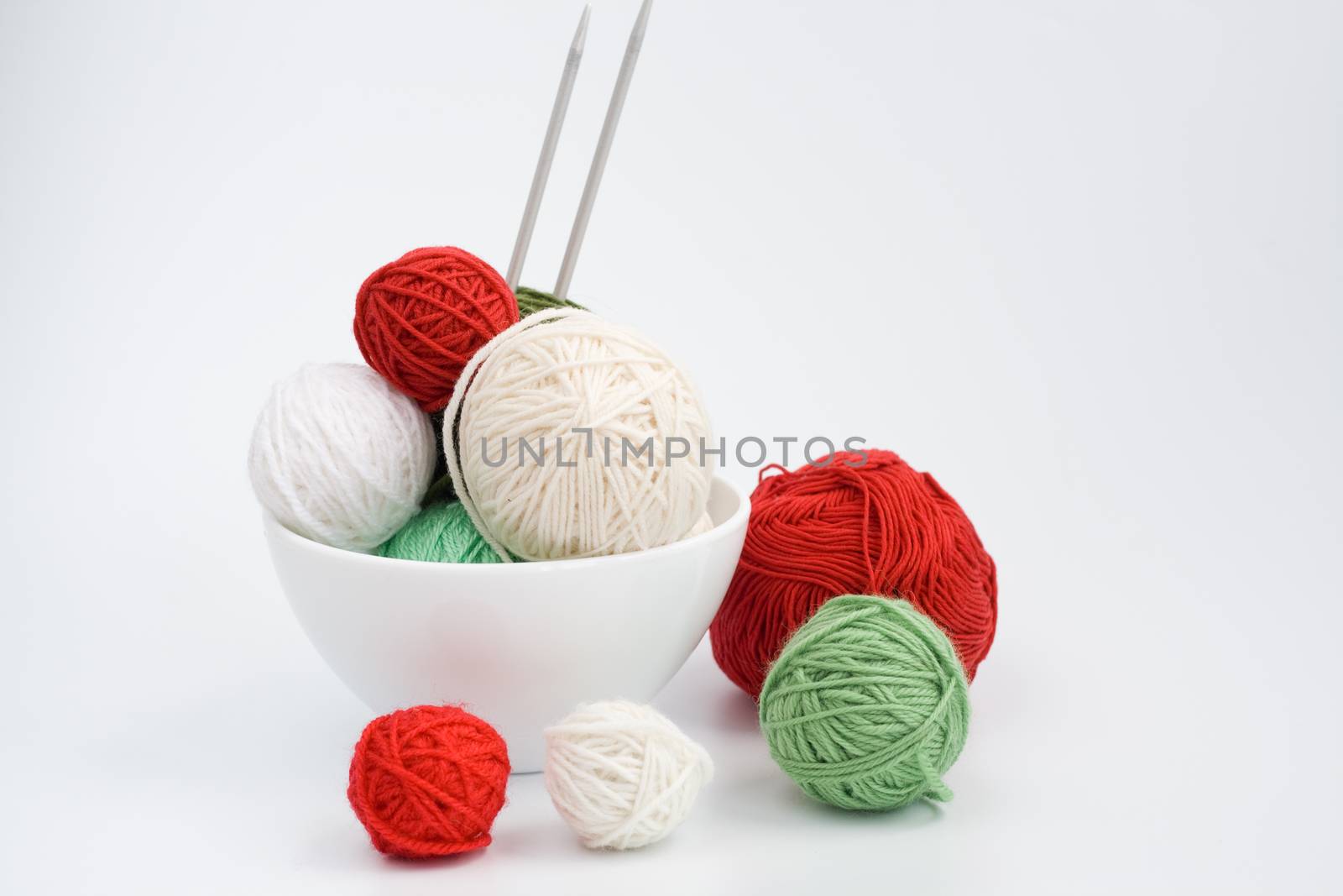 A lot of bright balls of knitting on the background