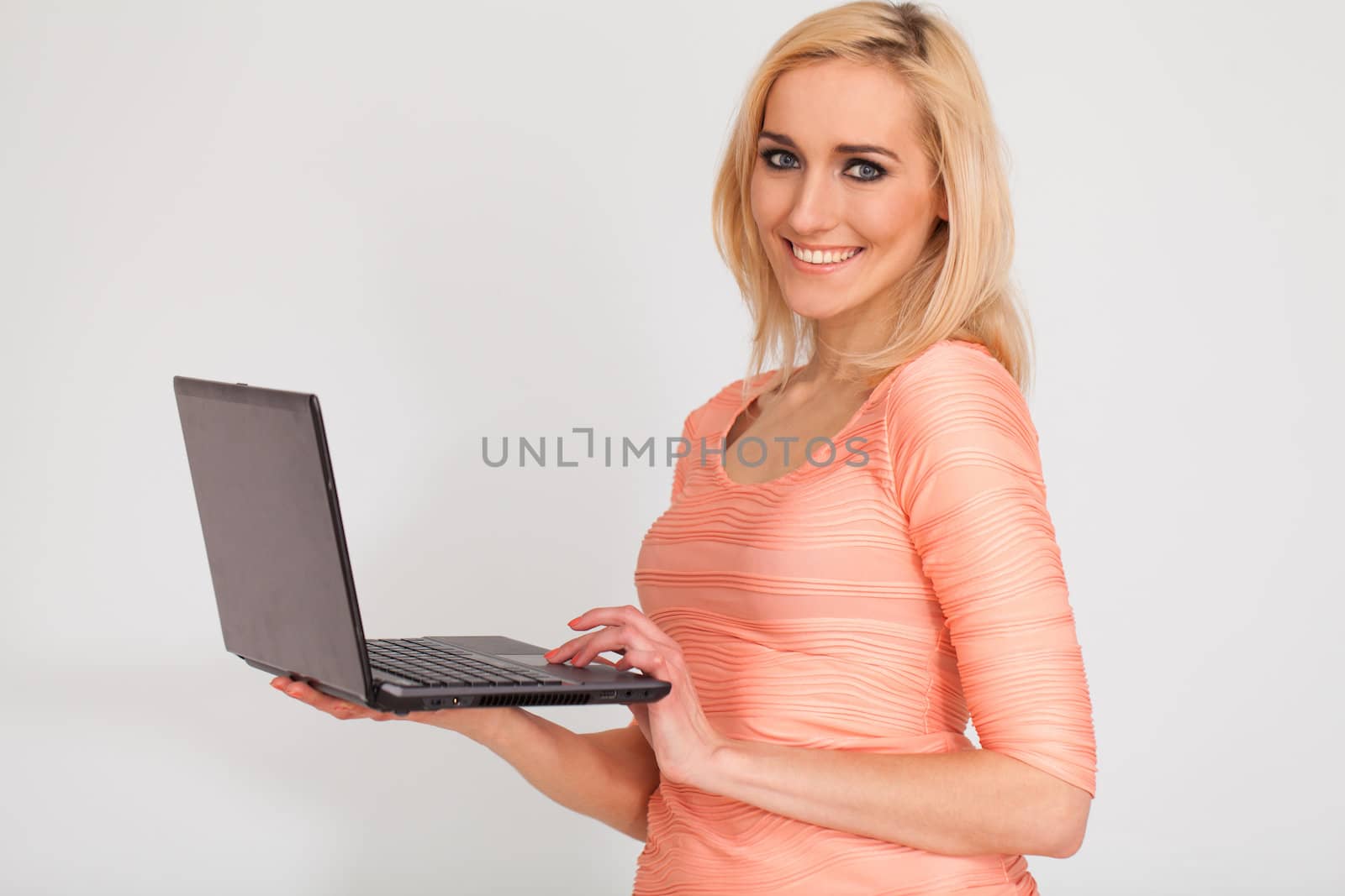 Portrait of beautiful caucasian woman with notebook isolated over white background