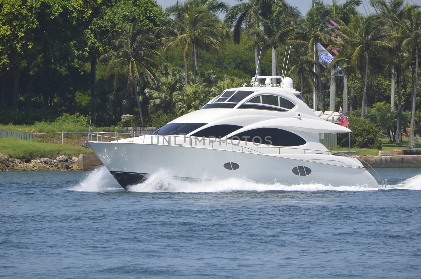 Upscale luxurious sport fishing boat cruising through Government Cut,Miami,Florida on it's way to deep sea fishing grounds.