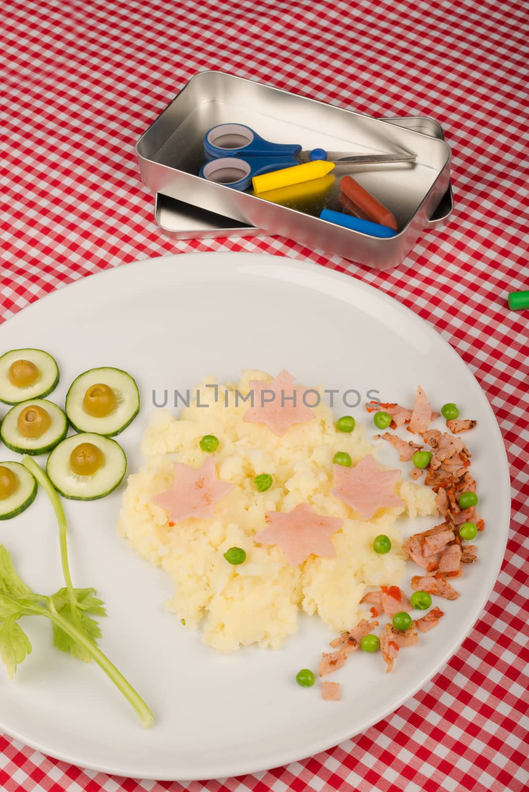 Mashed potatoes with some raw vegetables, kid meal