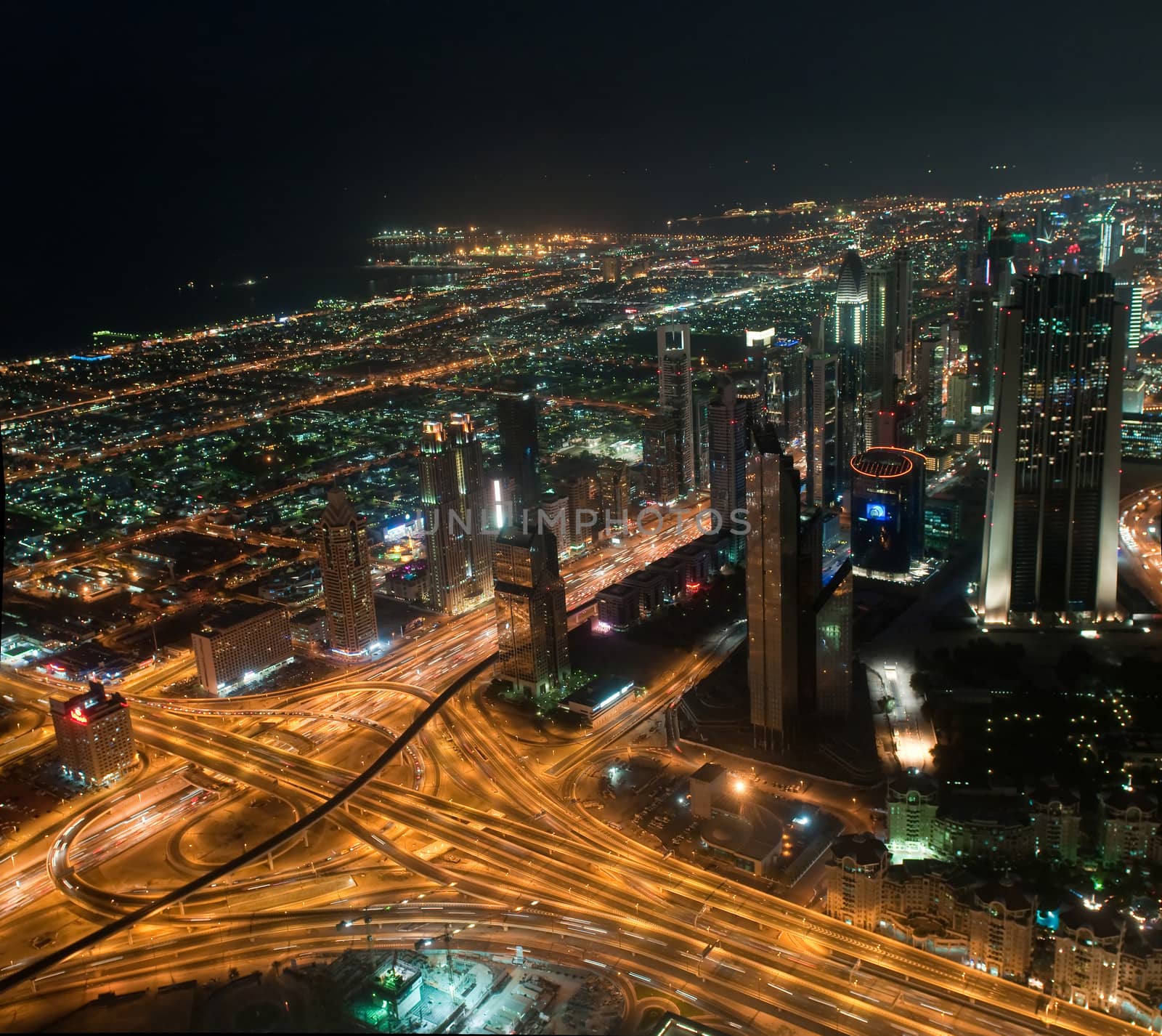 Skyscrapers in Dubai at night. View from the lookout Burj Khalifa. United Arab Emirates