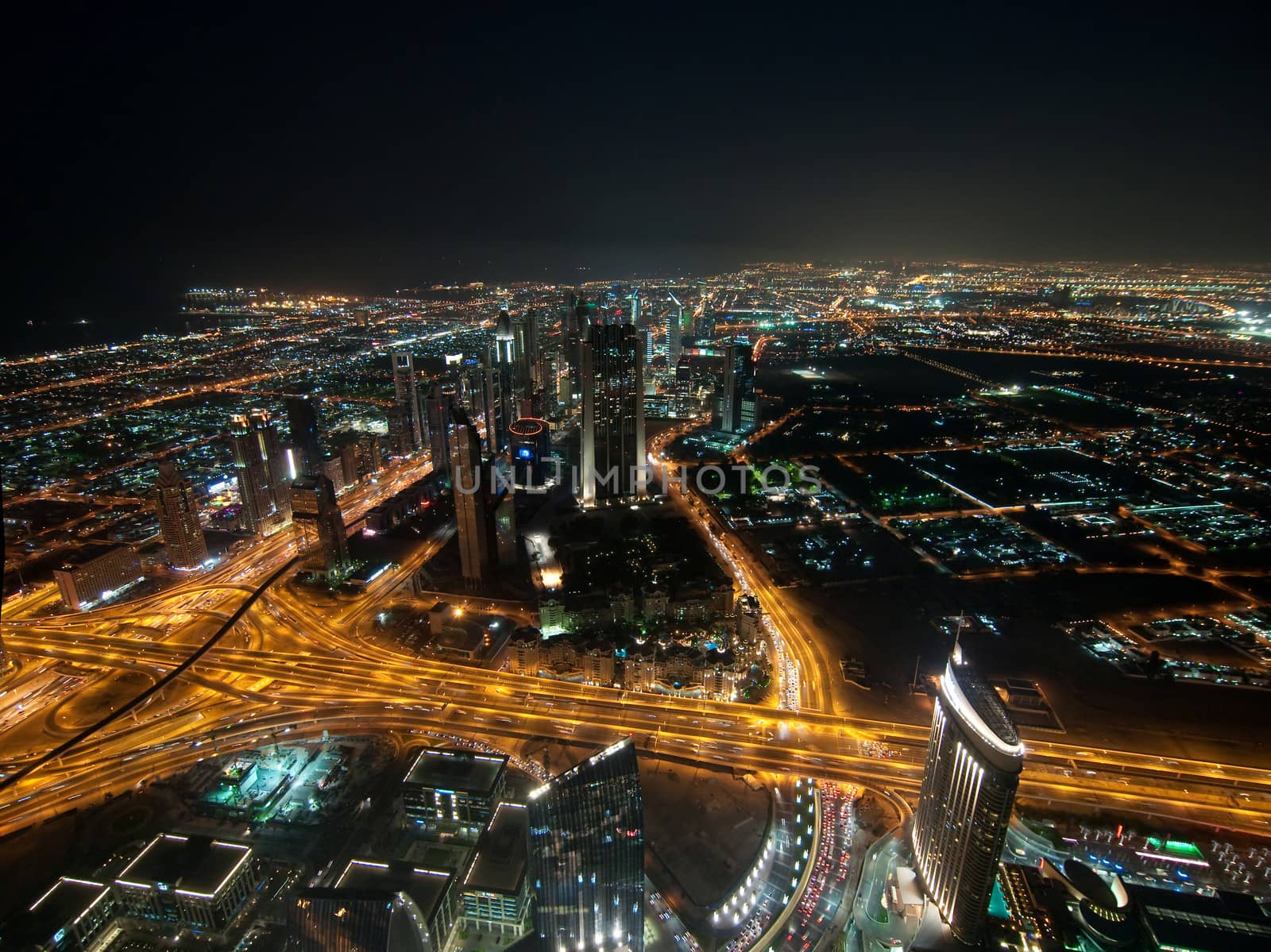 Skyscrapers in Dubai at night. View from the lookout Burj Khalifa. United Arab Emirates