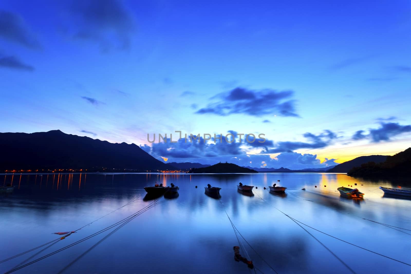 Sunrise coast with fishing boats