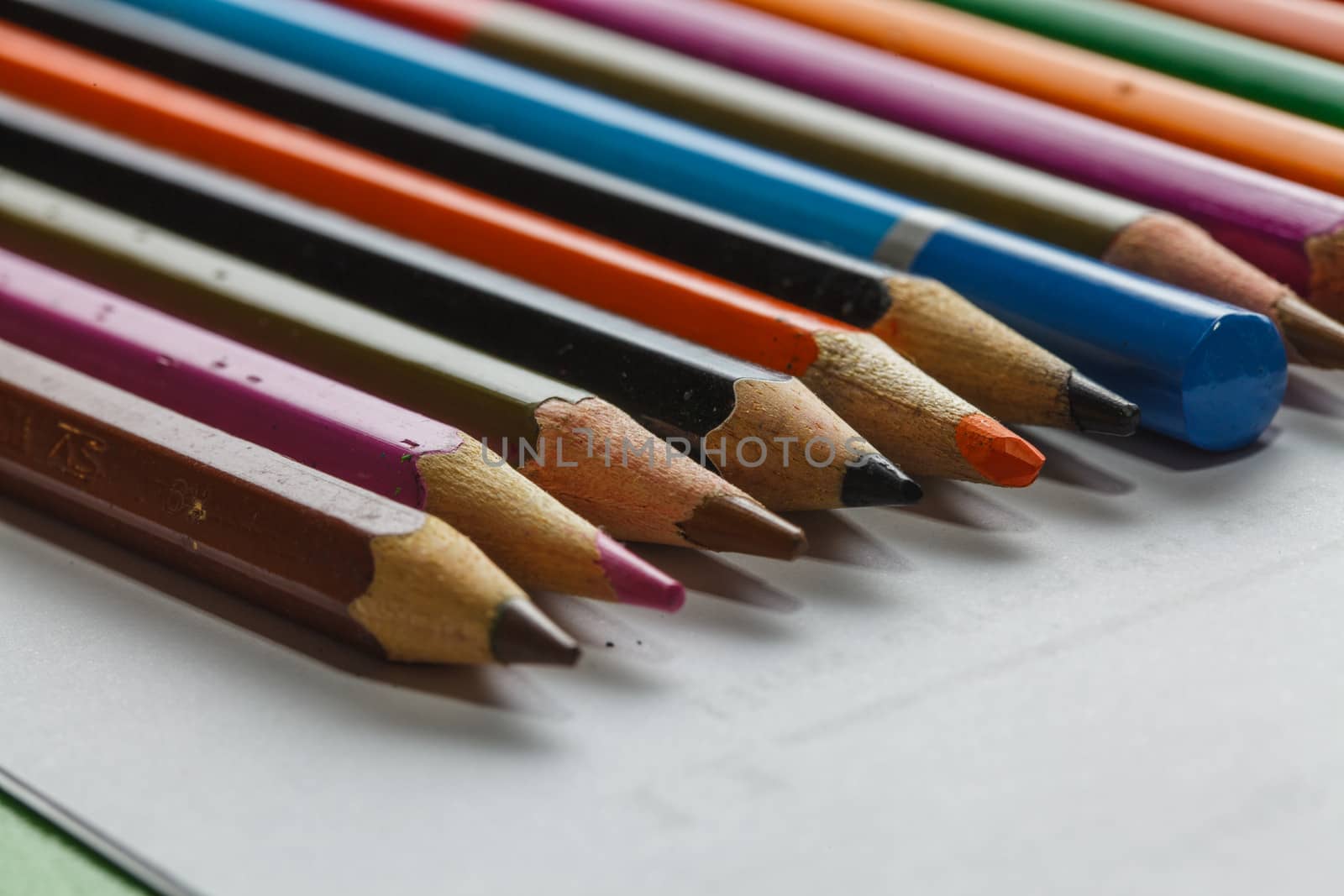 Colour pencils isolated on white background close up  by thanomphong