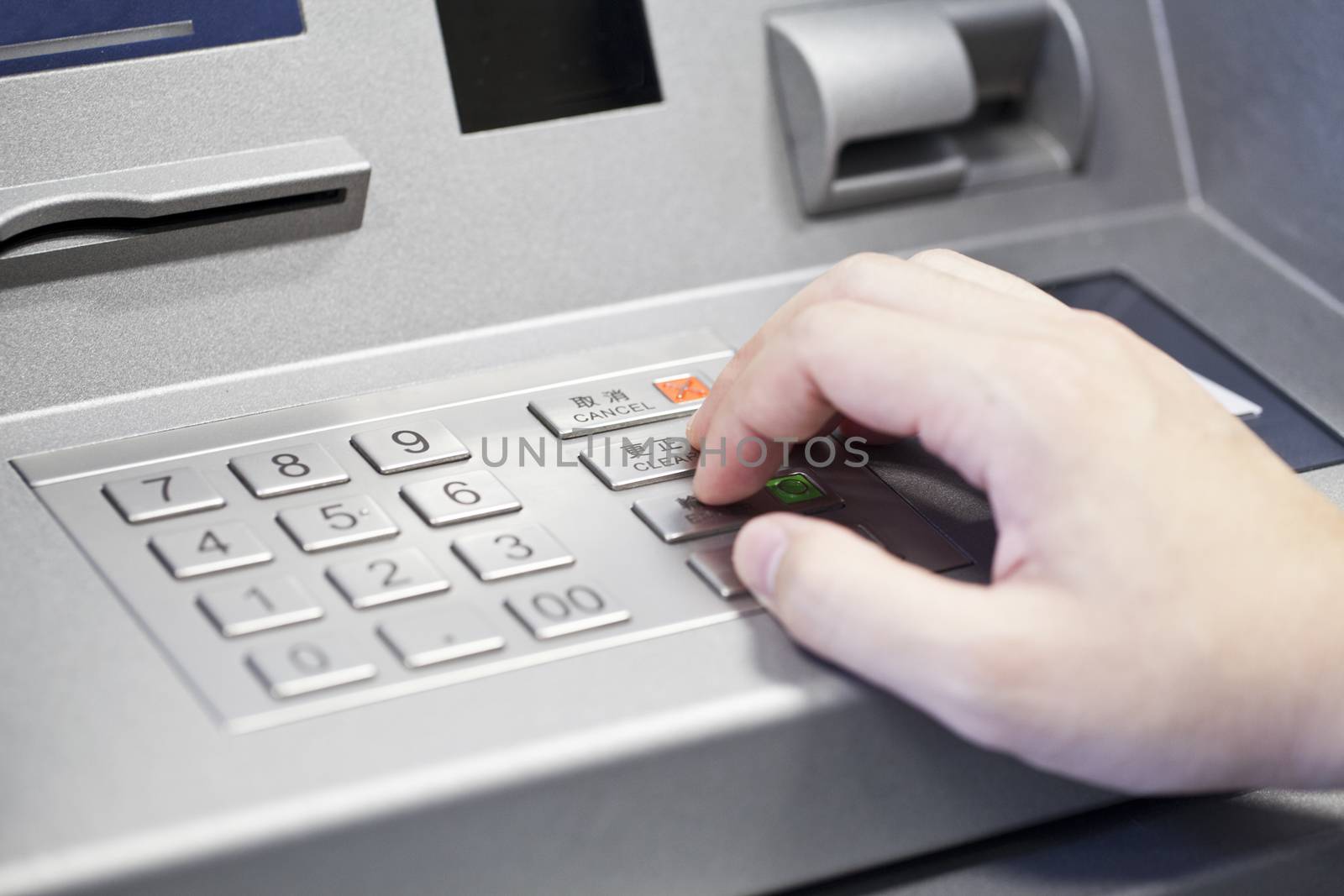 Human hand enter atm banking cash machine pin code  by kawing921