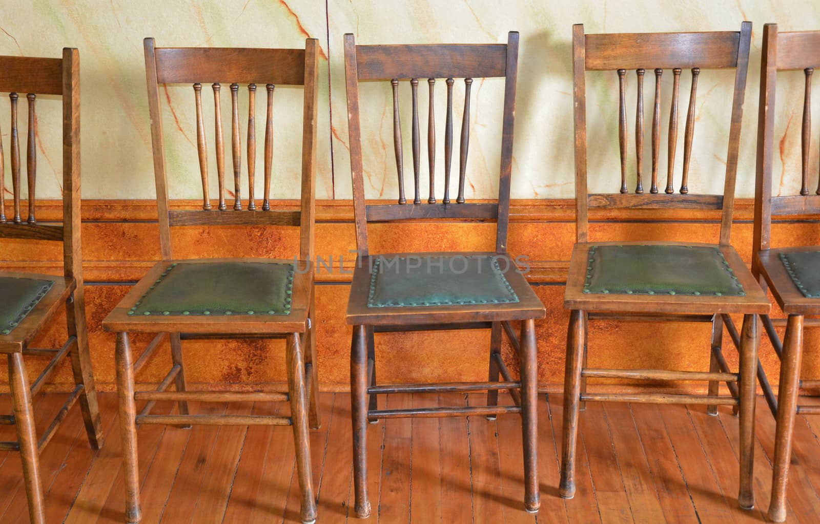 Old wooden chairs on hardwood floor