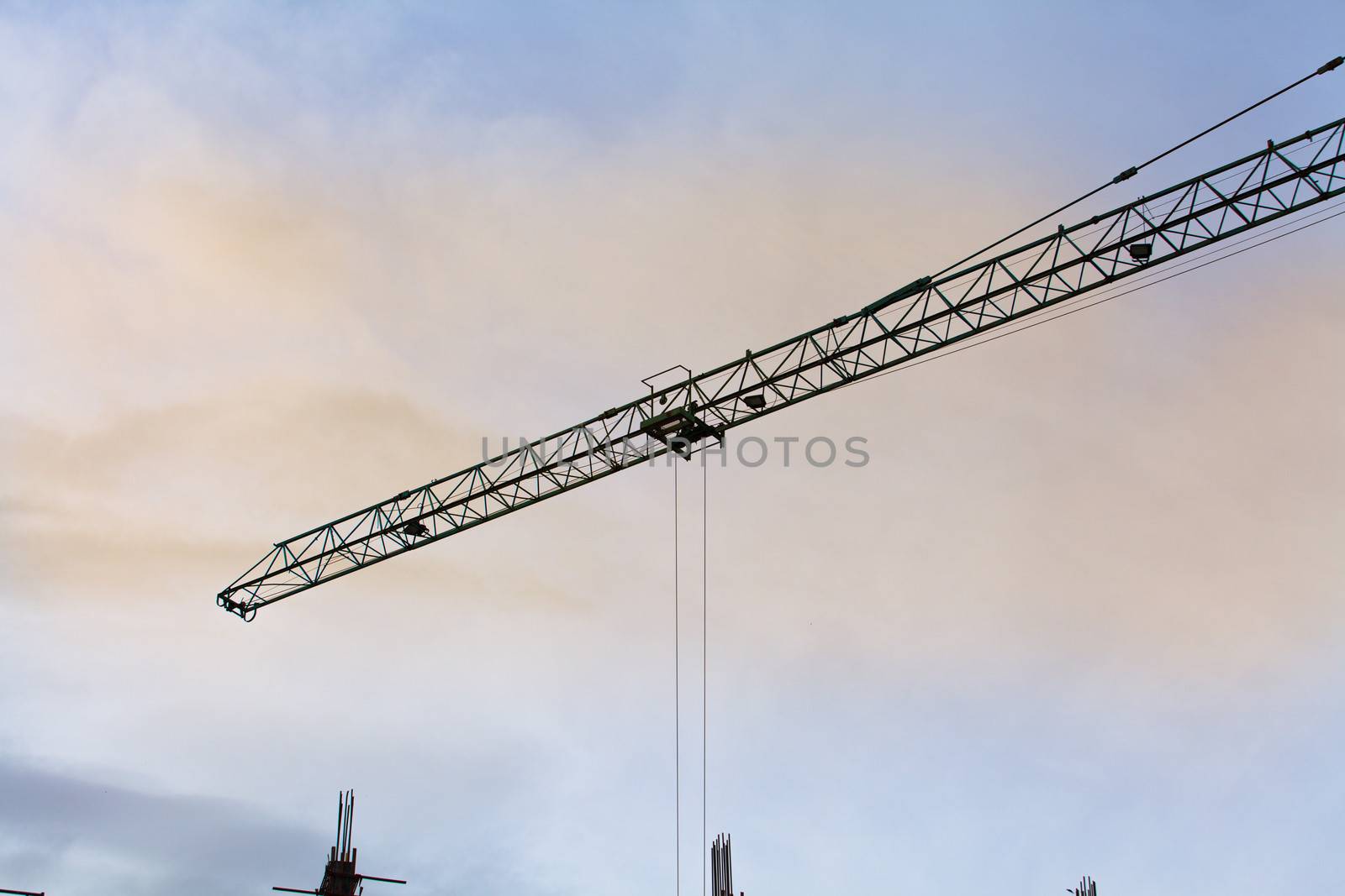 Construction site with  crane with sunset.