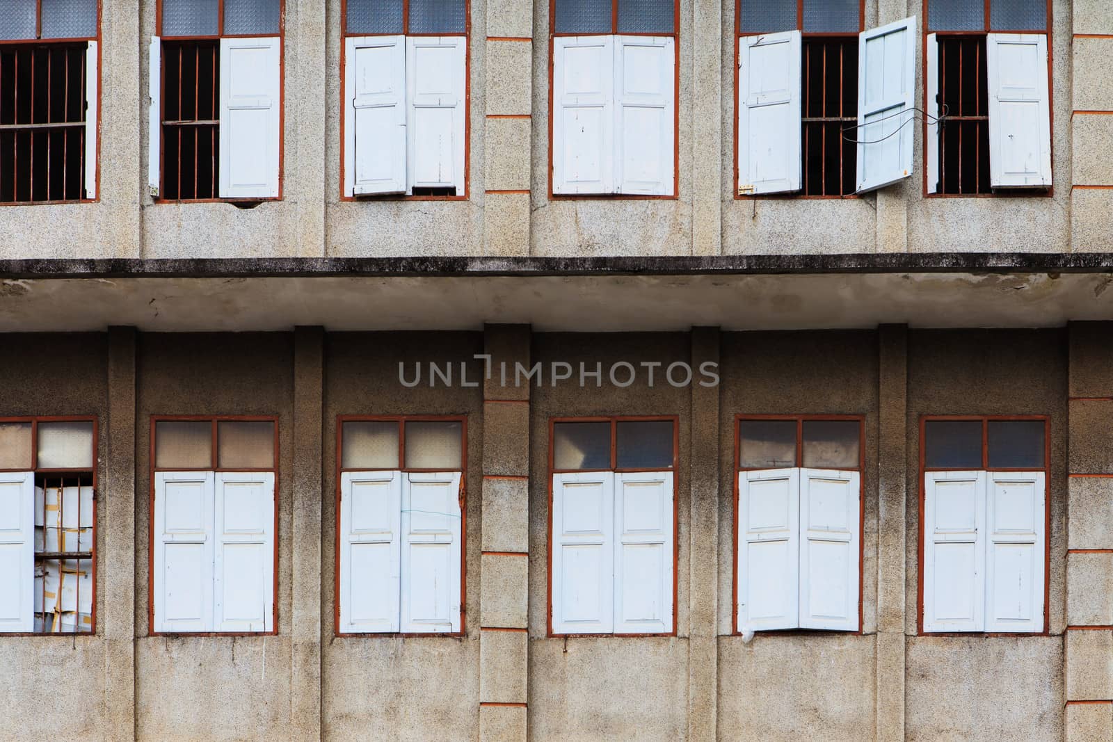 Old windows on ruin house  by thanomphong