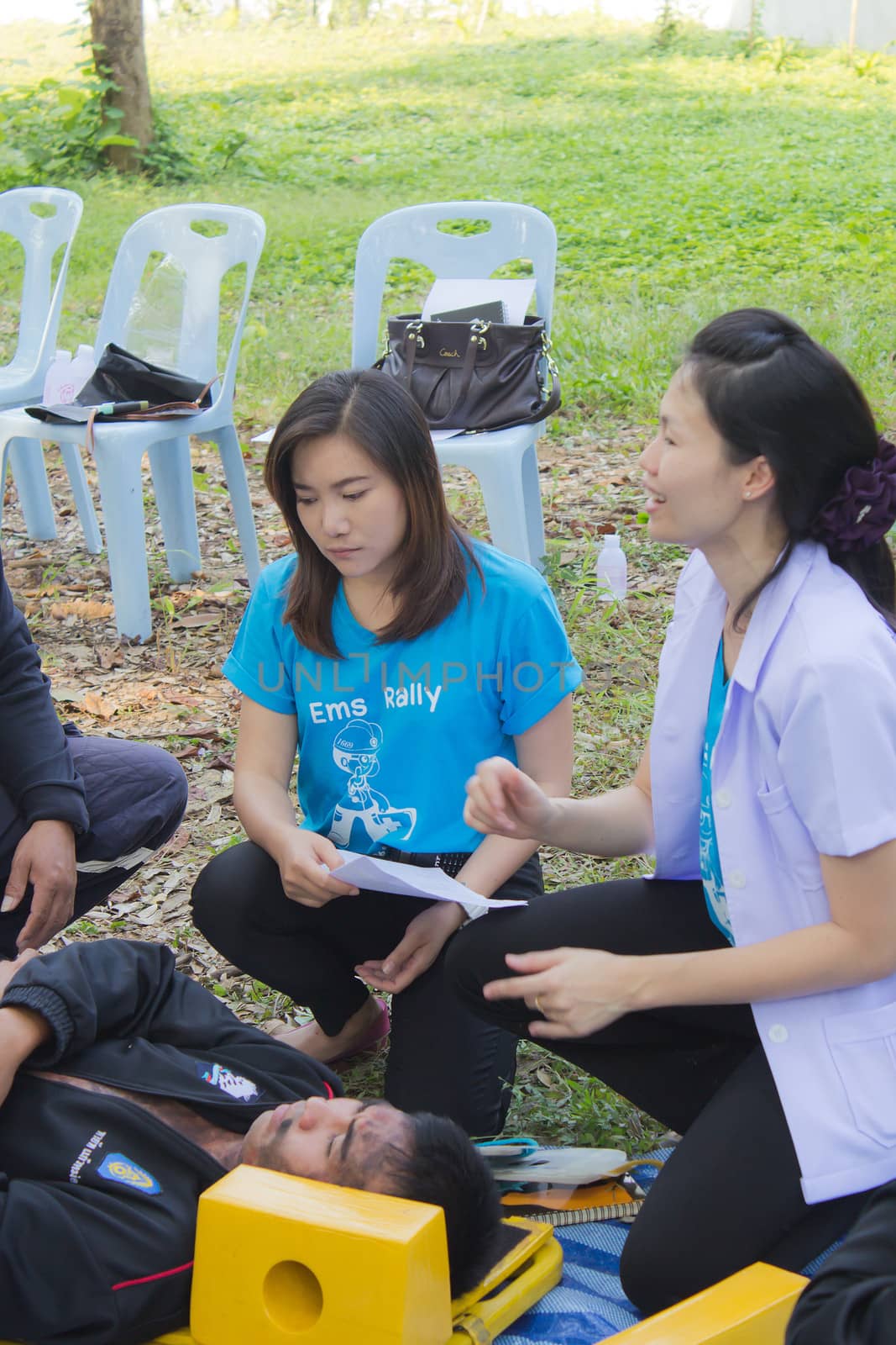 PHRAE,THAILAND - DECEMBER 20 : Unidentified  men are first aid training from staff  the hospital on  December 20, 2012 at local parks, Muang, Phrae, Thailand.