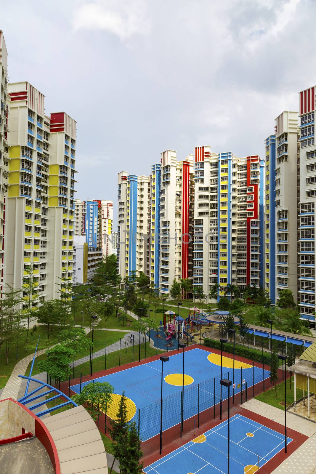 A new colorful neighborhood estate with carpark and playground.