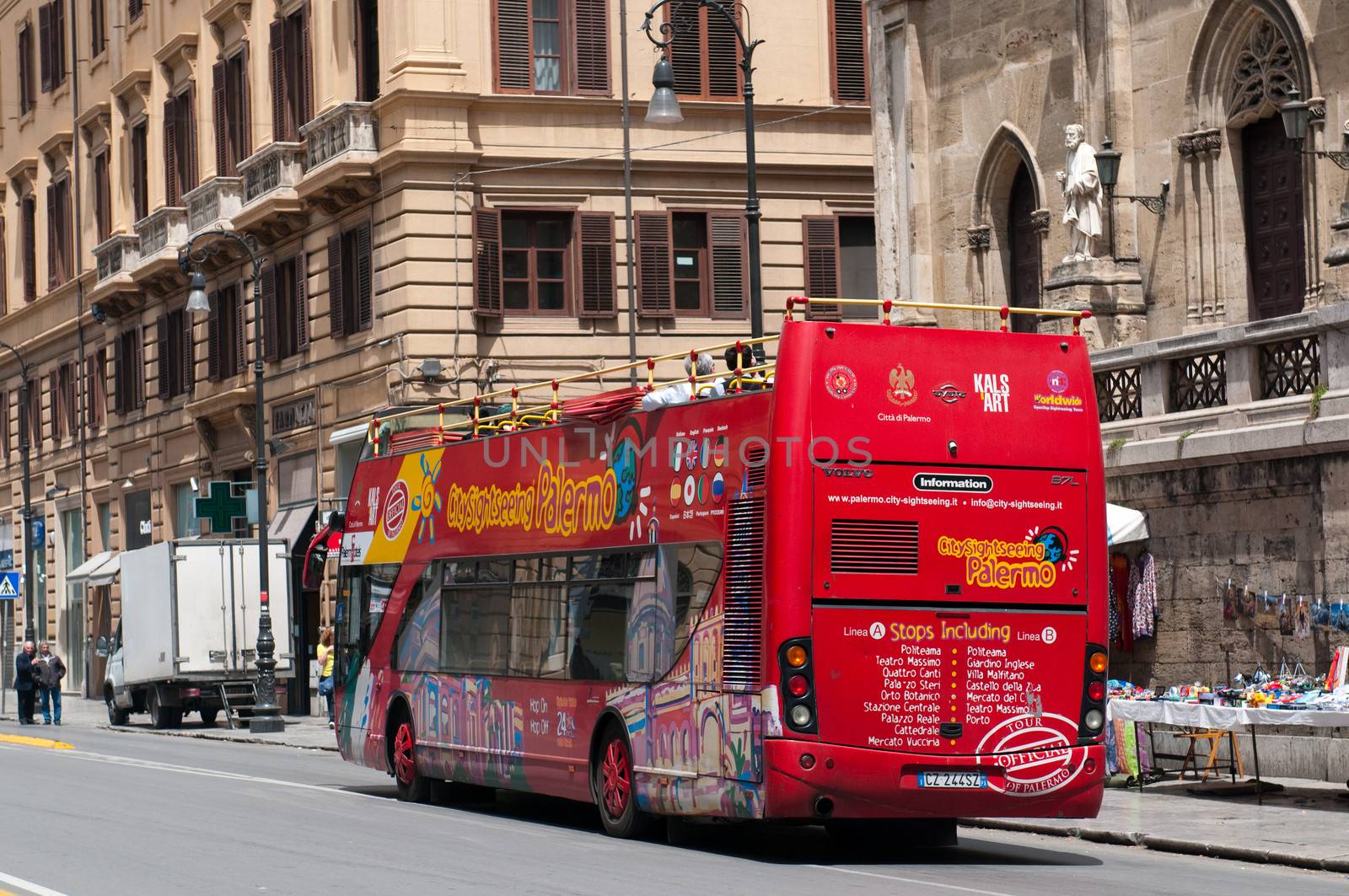 Palermo, Italy - May 2, 2011: Tourist bus on street of Palermo. Crowds of tourists visit Palermo - a historic city in Southern Italy, the capital of Sicily and the Province of Palermo. Italy