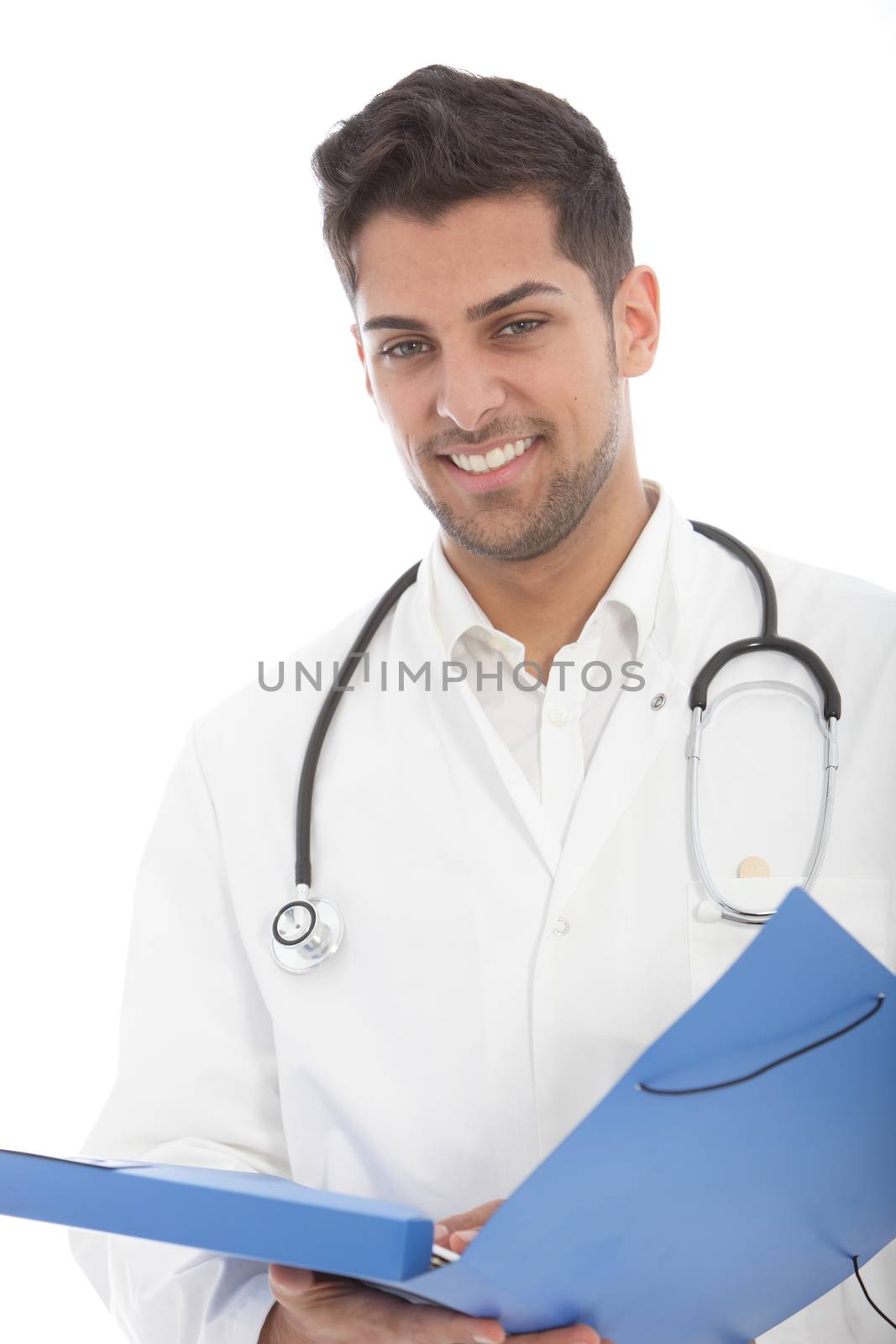 Handsome young male doctor looking at patient records in a handheld file on his ward round isolated on white