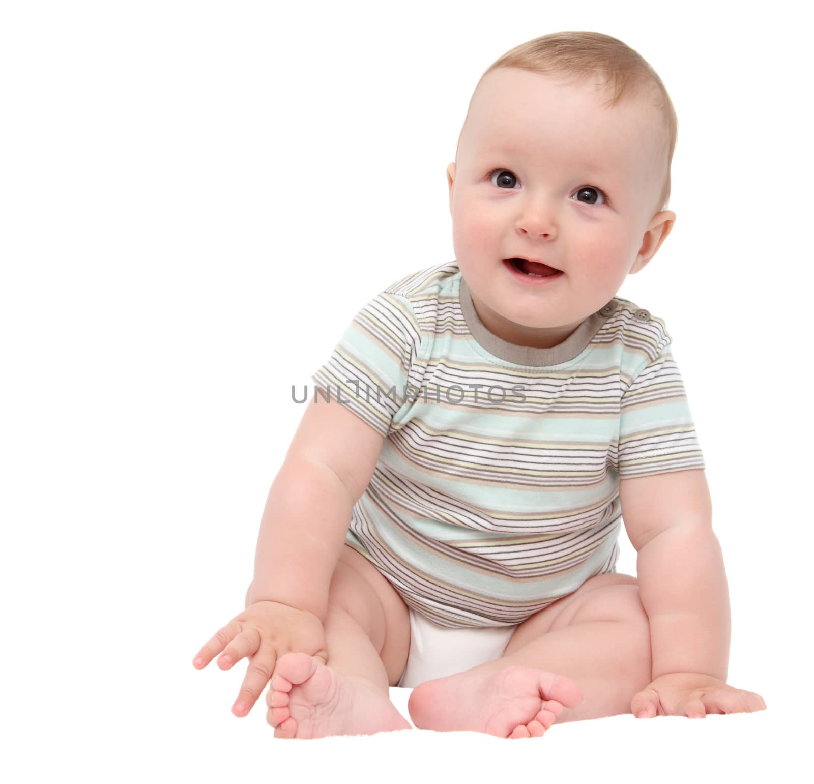 beautiful laughing happy baby boy sitting on white bed by NikolayK