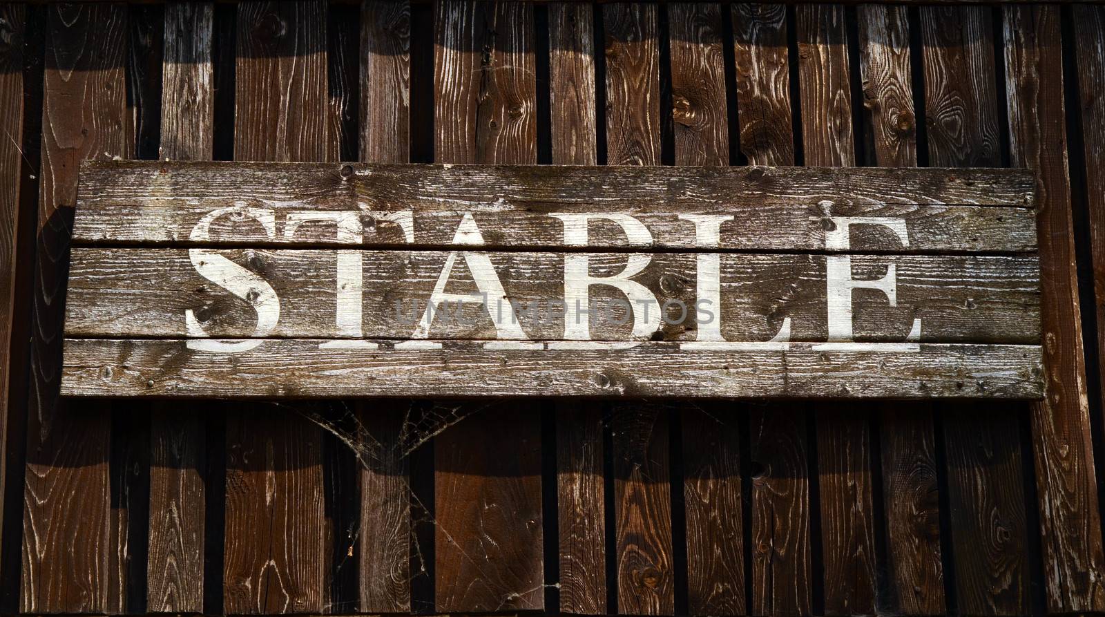 Rustic Sign For A Stable On A Ranch In Western USA