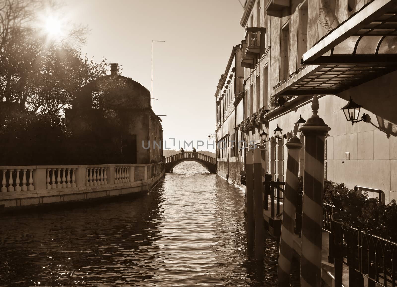 Crossing over the channel.  Sepia image of Venice