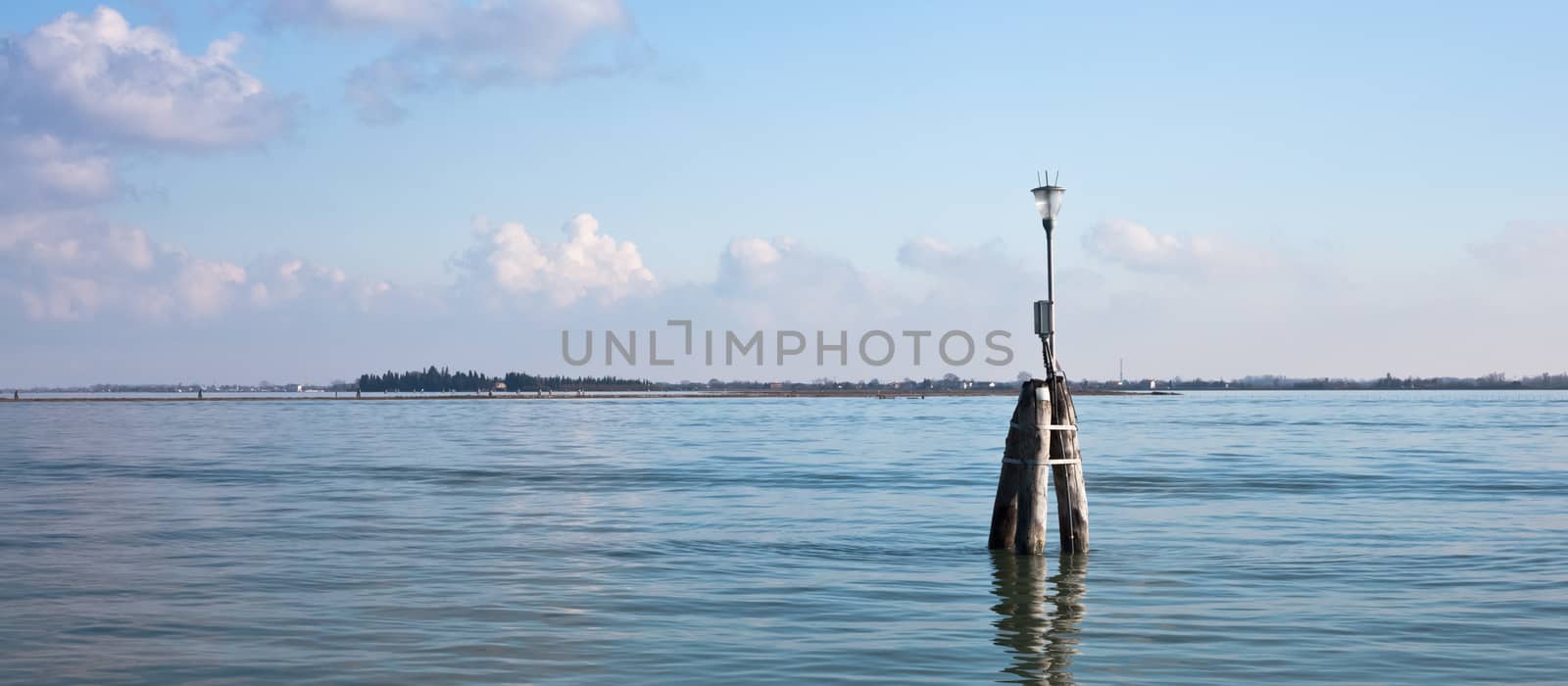 Venetian buoy along fairway channel between the islands