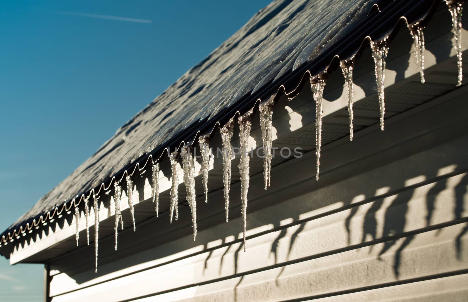 Melting icicles on the roof