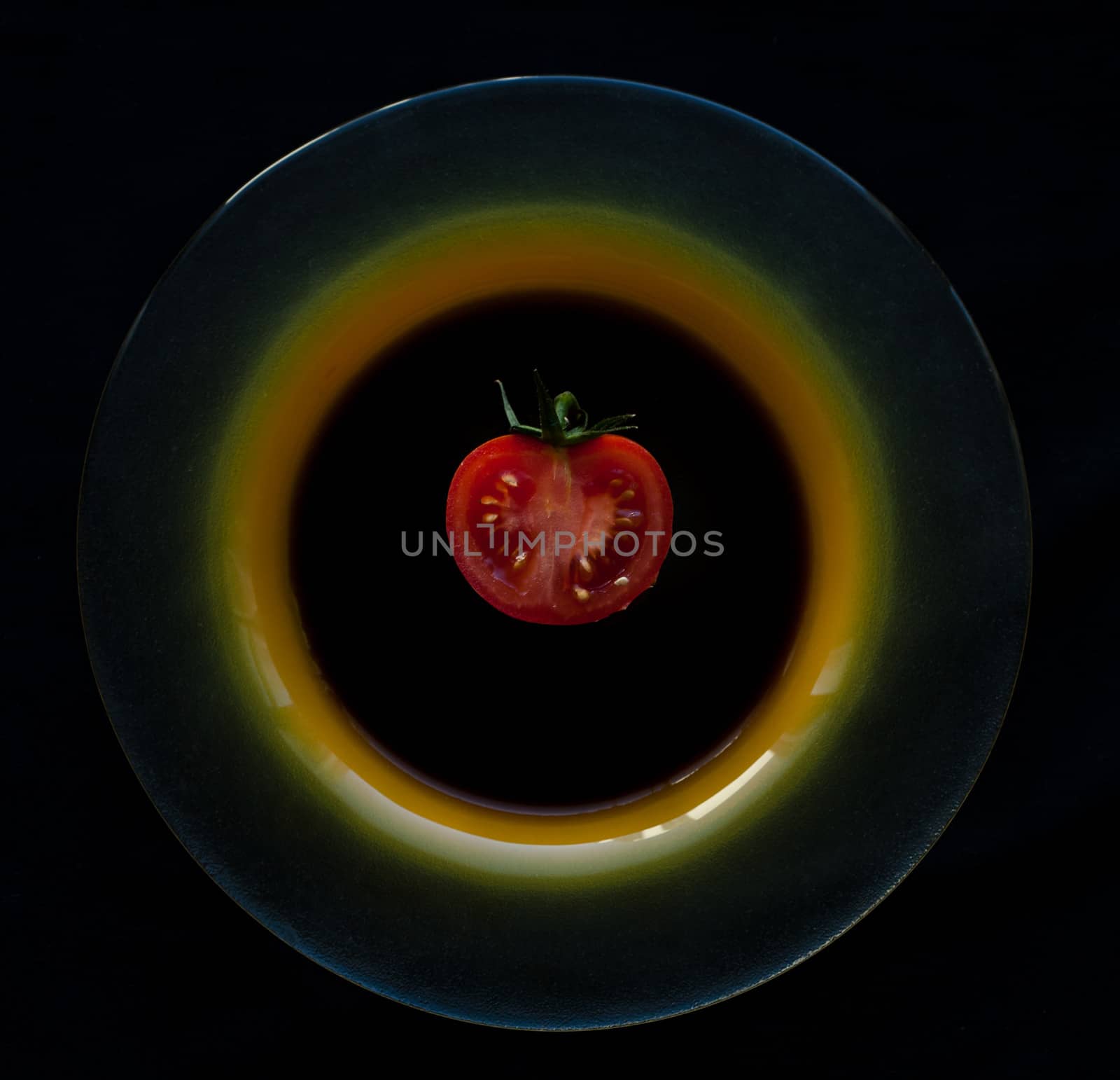 Red tomato on the plate
