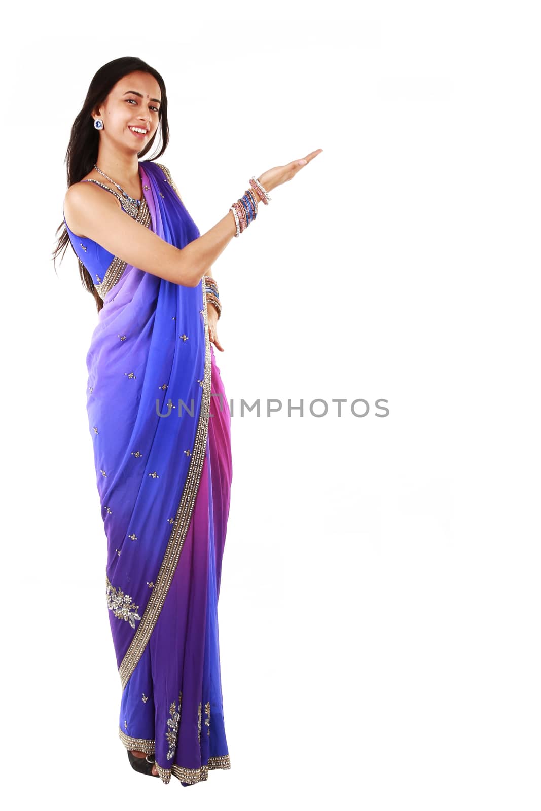 Young woman presenting. Isolated on a white background.