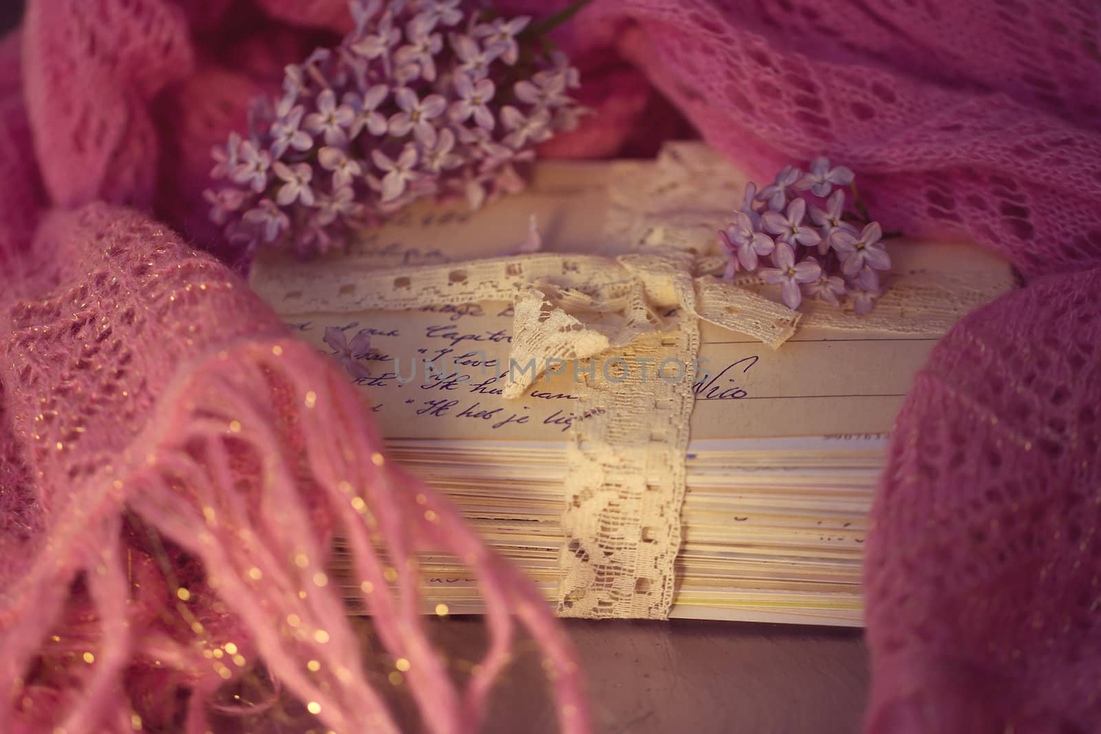 Stacks of old letters with lavender on soft scarf