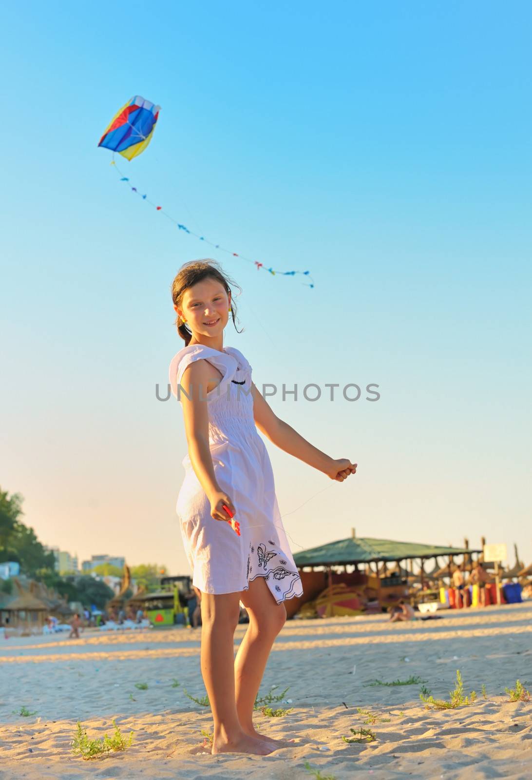 Girl on beach with kite  by mady70